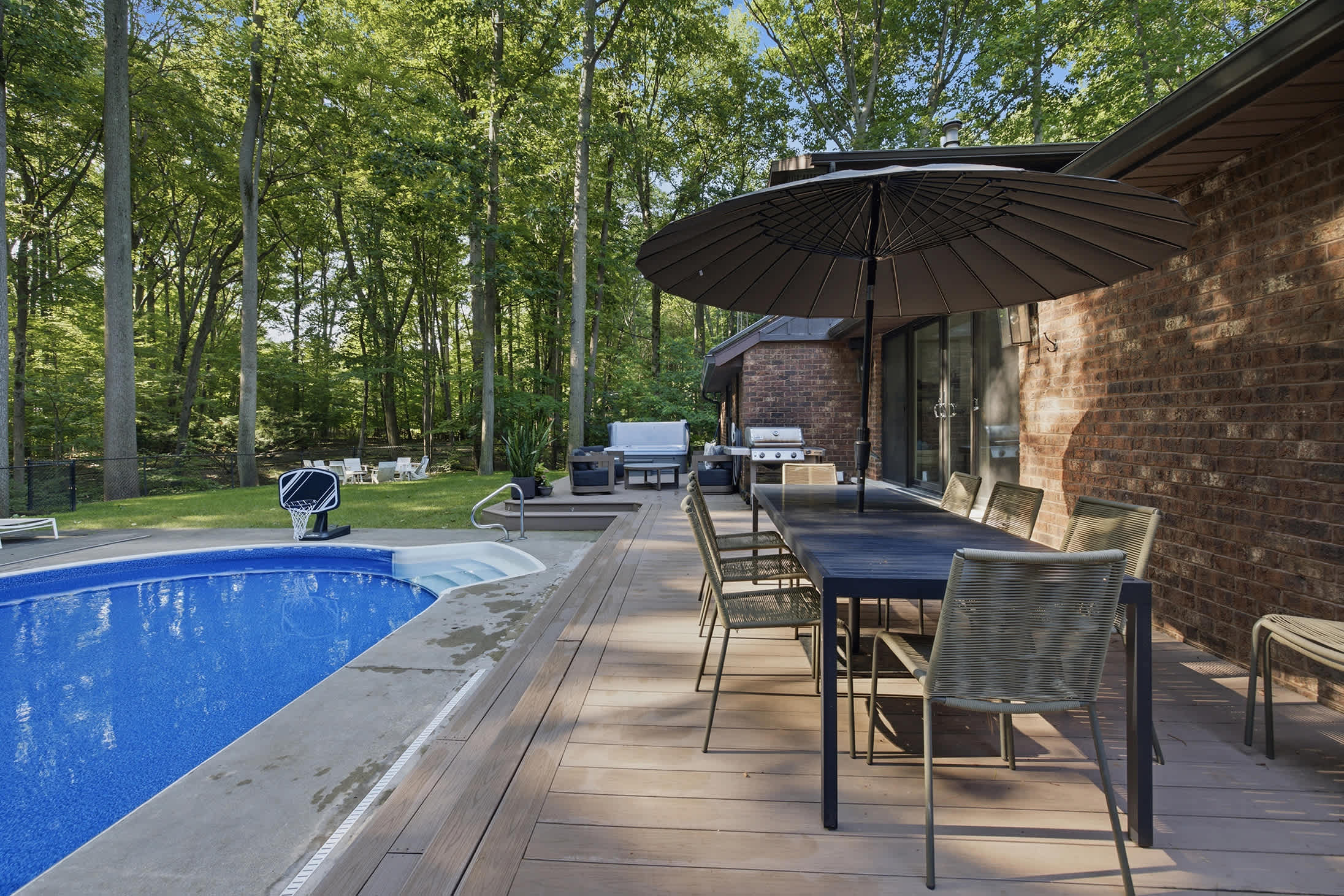 Private pool with shaded seating makes outdoor living comfortable all day long.