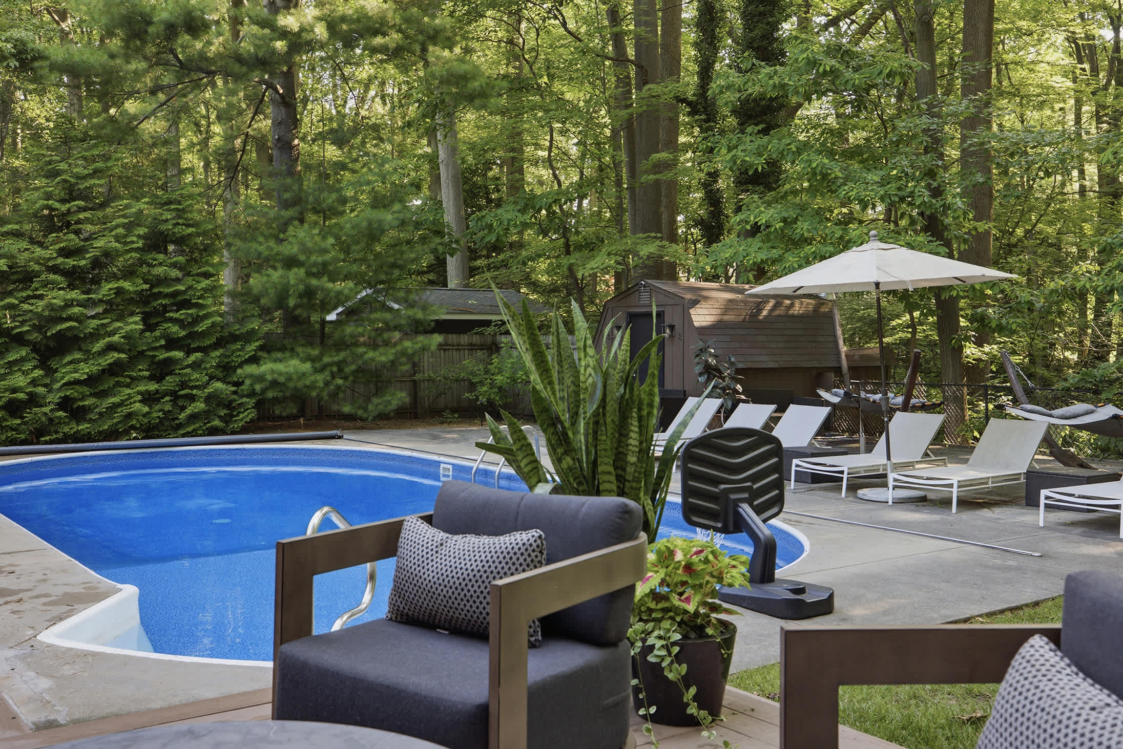 This retreat is for pool time, sunbathing, and unwinding under the trees.