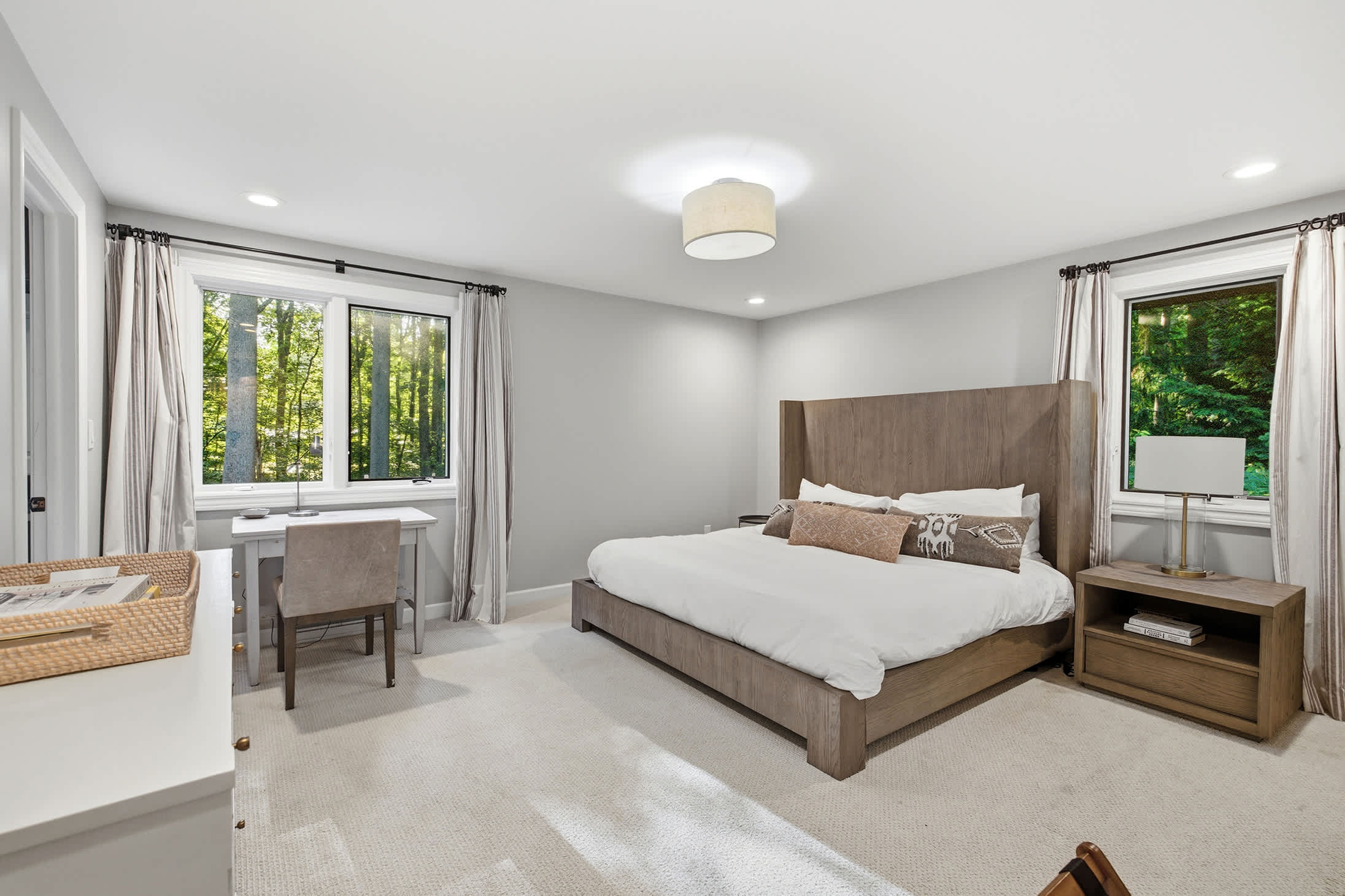 The primary bedroom is on the upper level and has a king-size bed + air mattress.