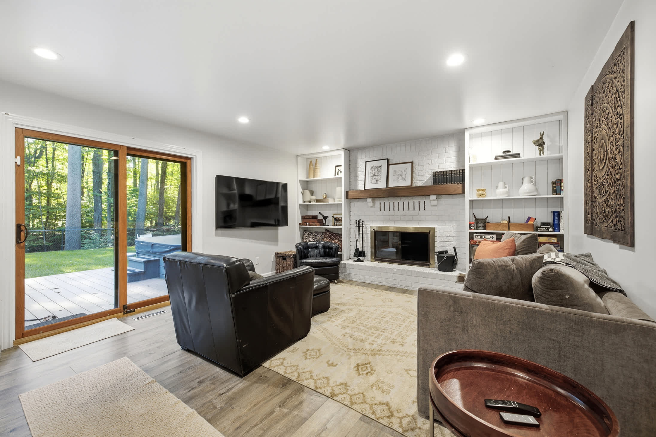 Settle in by the fire with woodland views just beyond the glass.