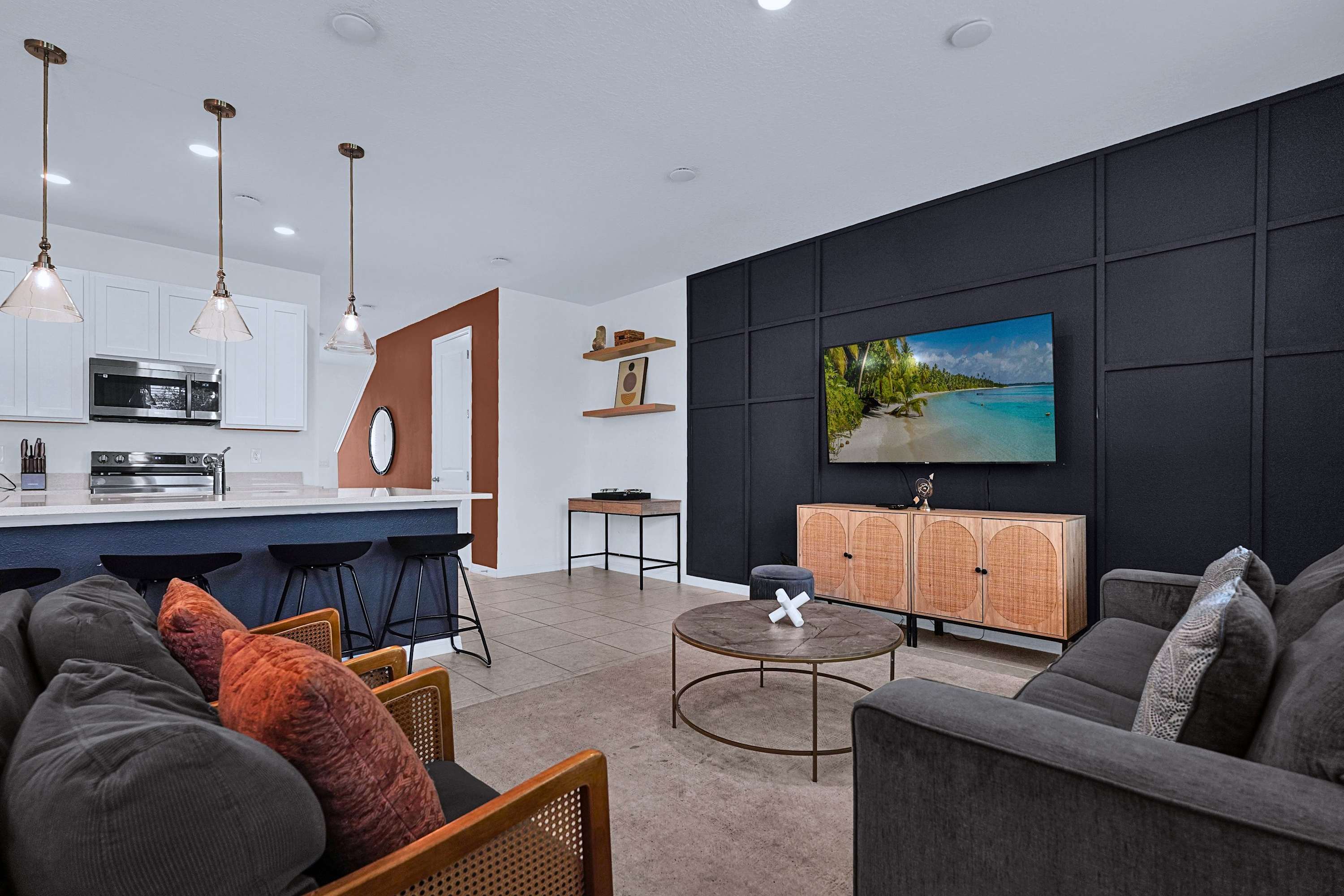 Living room featuring a Smart TV, cozy seating, and entertainment space for guests