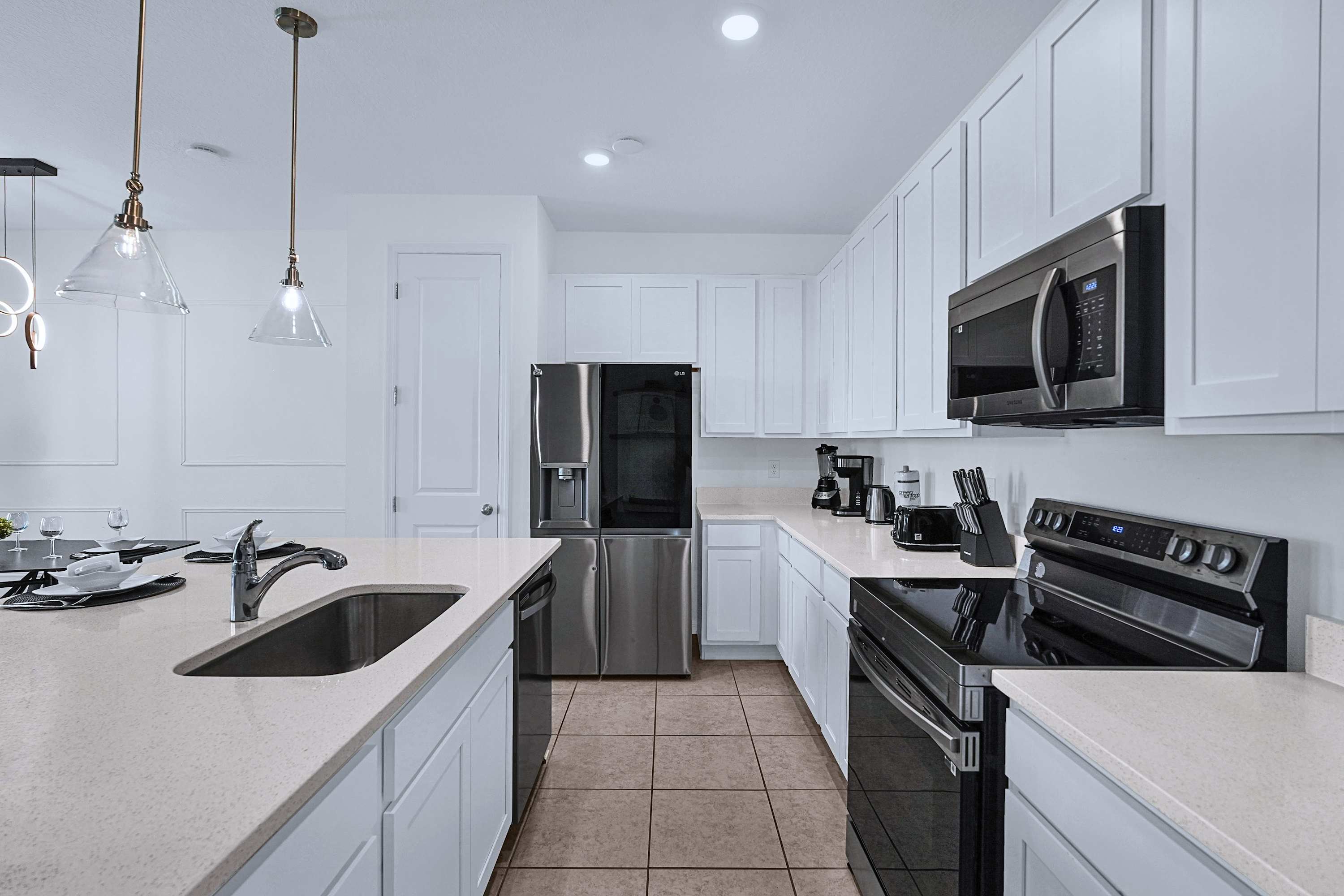 Well equipped kitchen featuring quality appliances and a functional cooking area