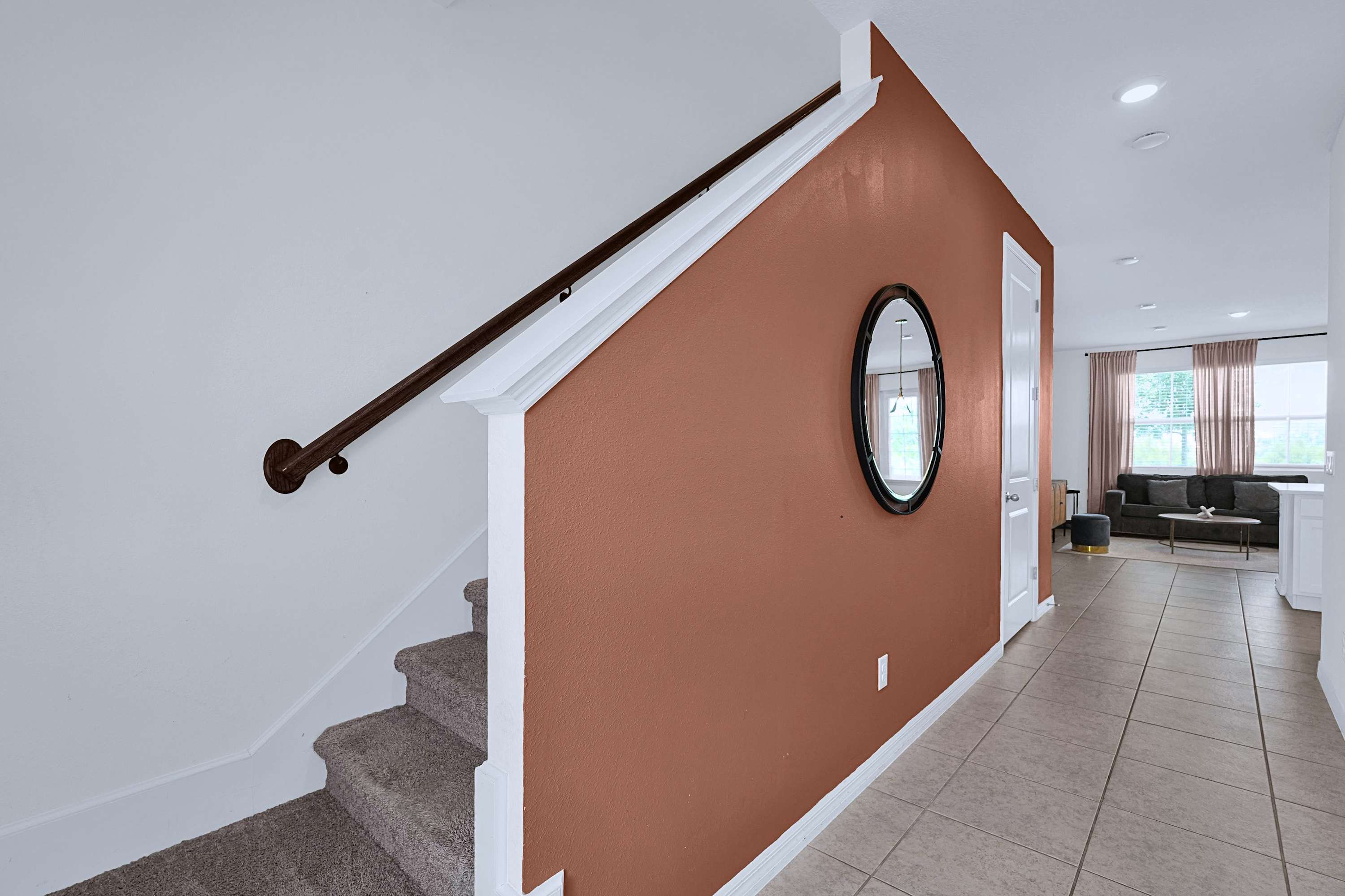 Stairway leading upstairs with a stylish design connecting every level of the home