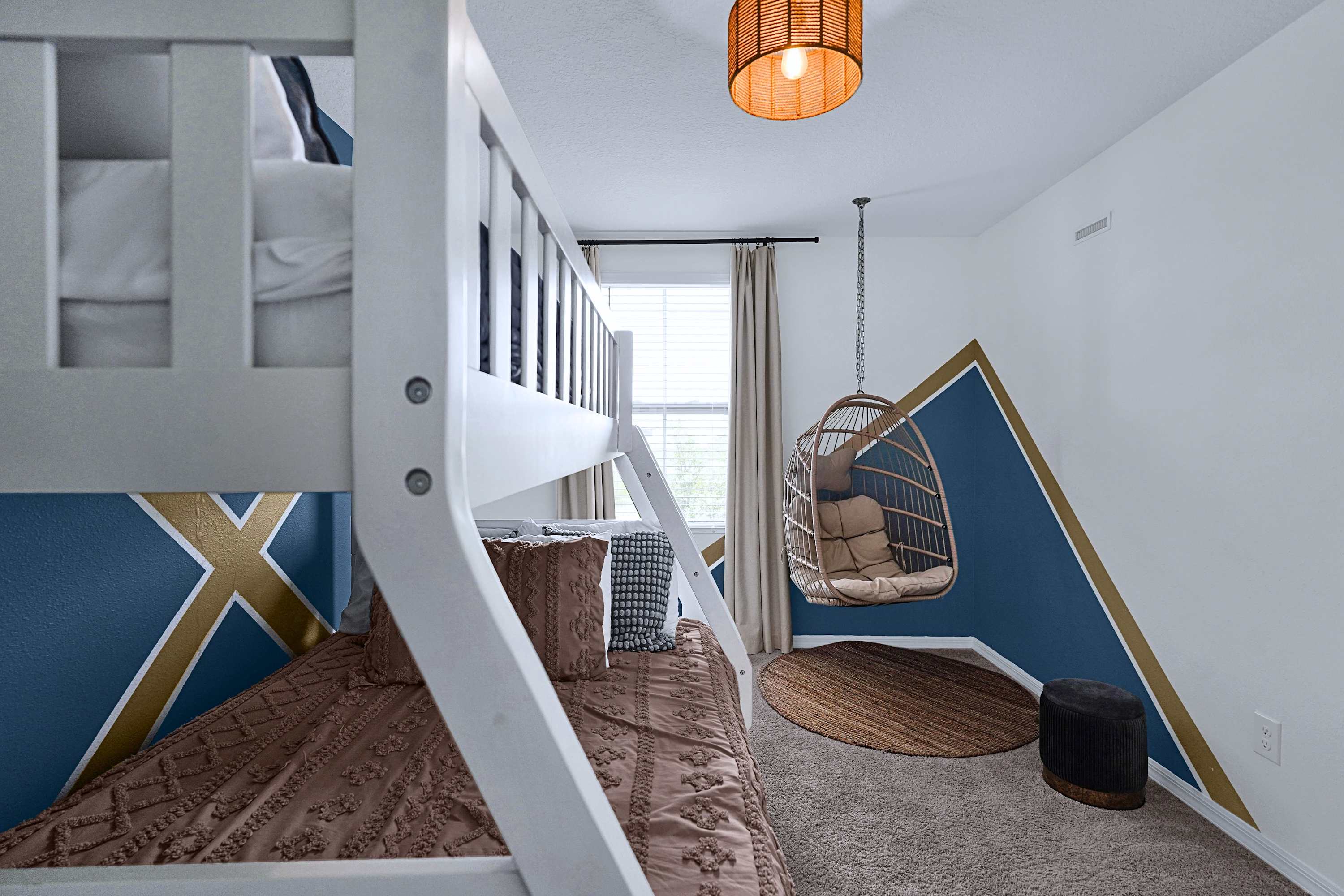 A unique retreat featuring elevated bunk beds and a relaxing hammock corner