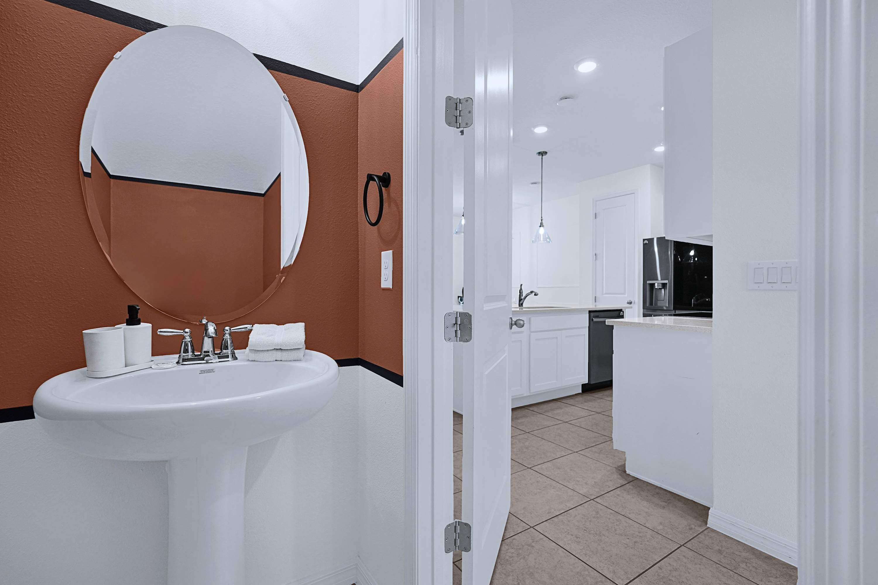 Bright bathroom setup with mirror, sink, and practical vanity space