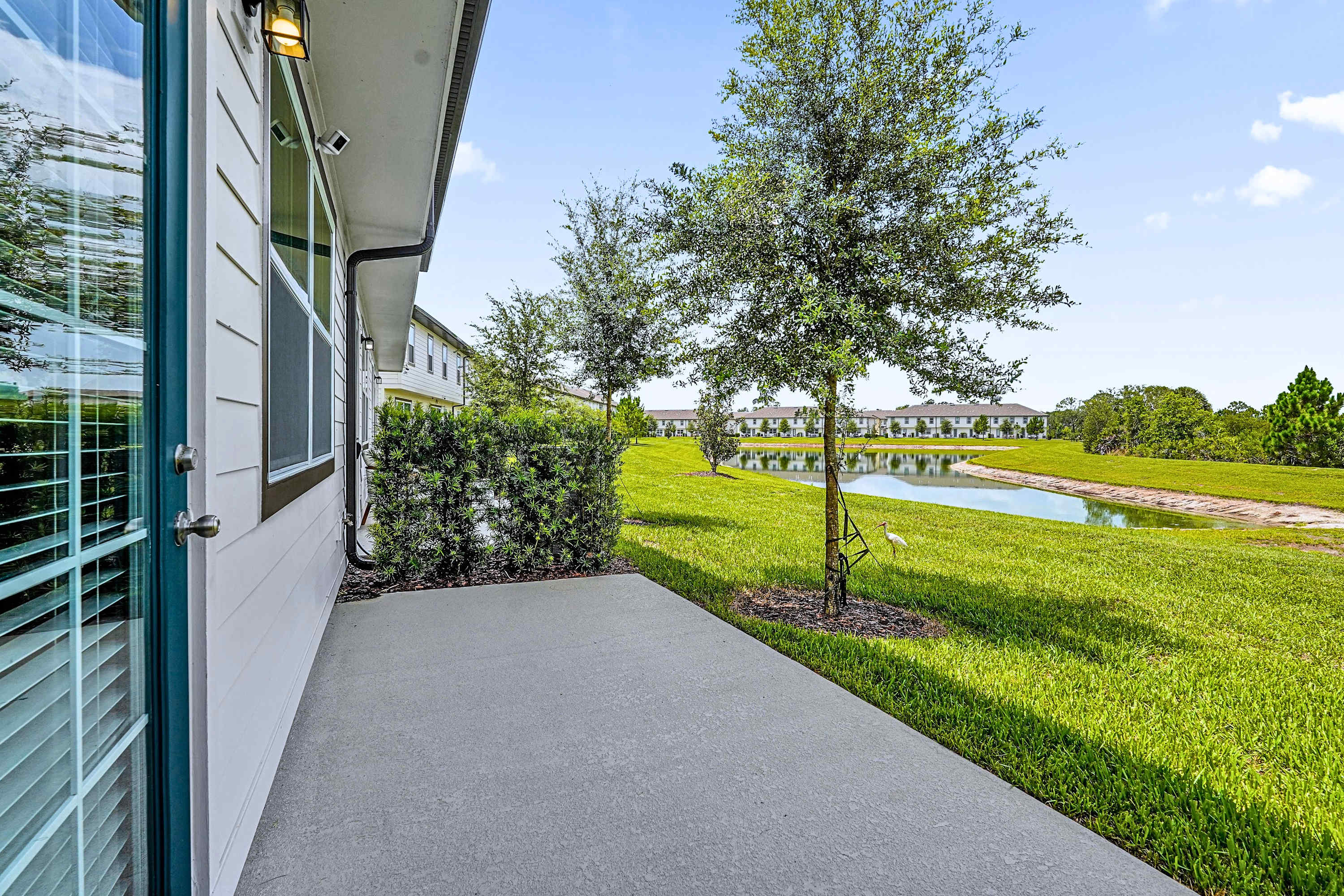 Enjoy peaceful lake views from the side of the property surrounded by natural beauty