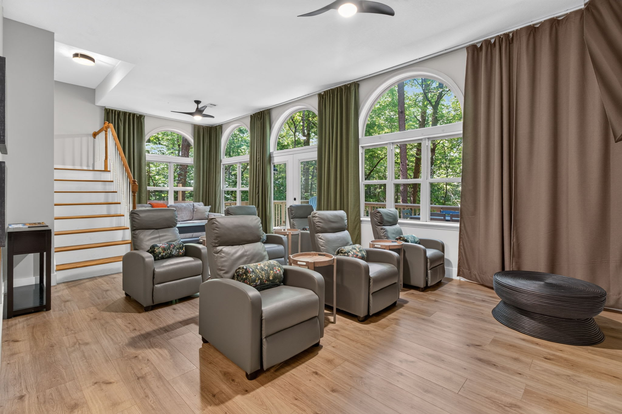 Experience cinema-style comfort with reclining seats and built-in cup holders.
