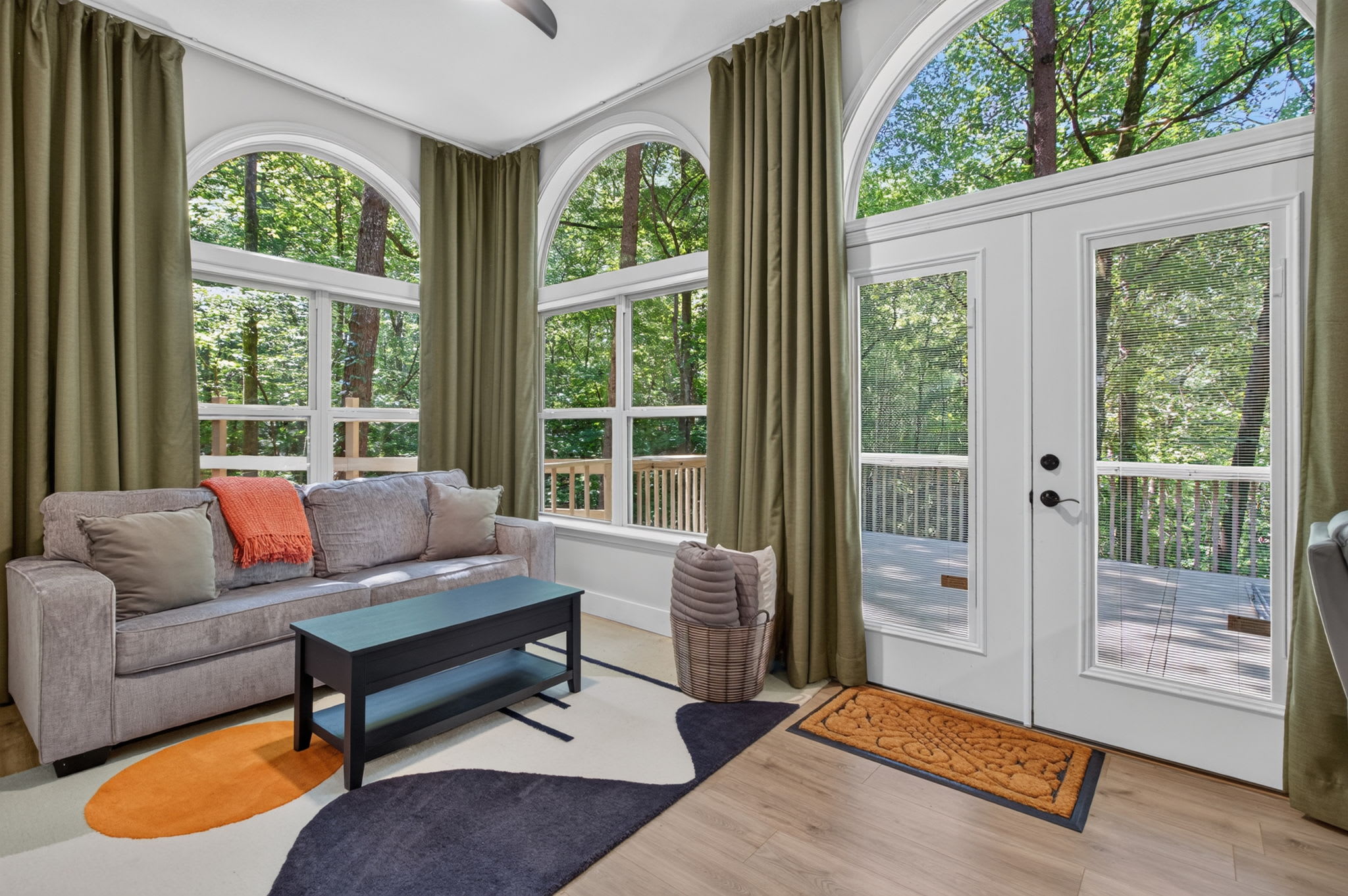 A fresh perspective of the lounge with arched windows.