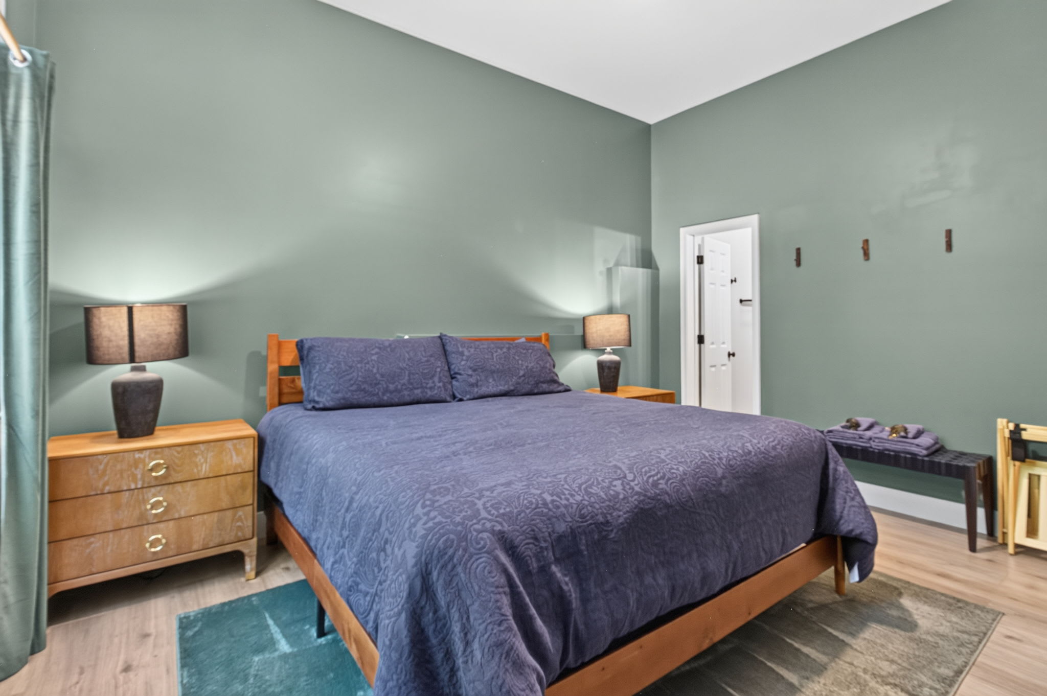 Bedroom 2 provides a relaxing space with rustic wood accents and soft linens.