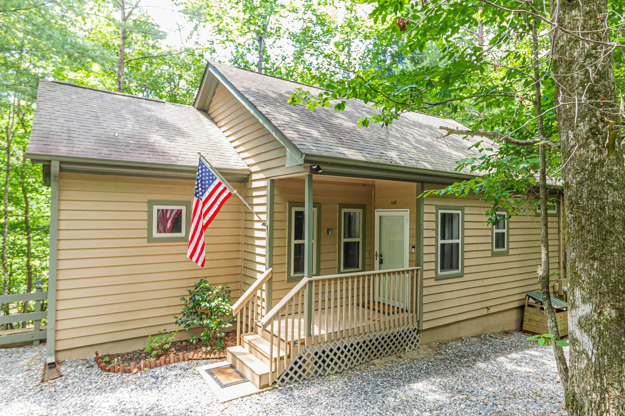 Another perspective of the cabin’s rustic exterior.