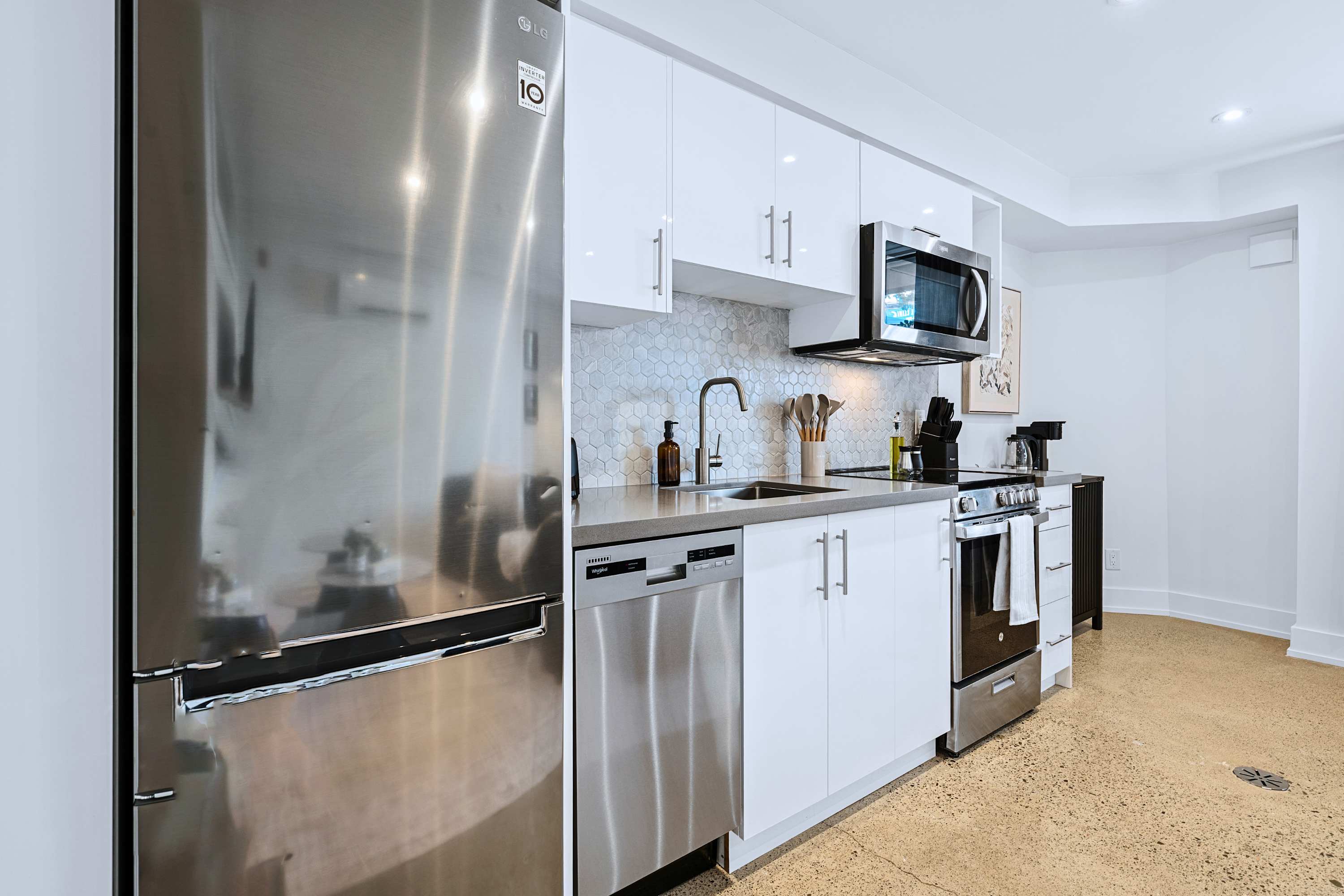 Fully equipped kitchen with silver appliances