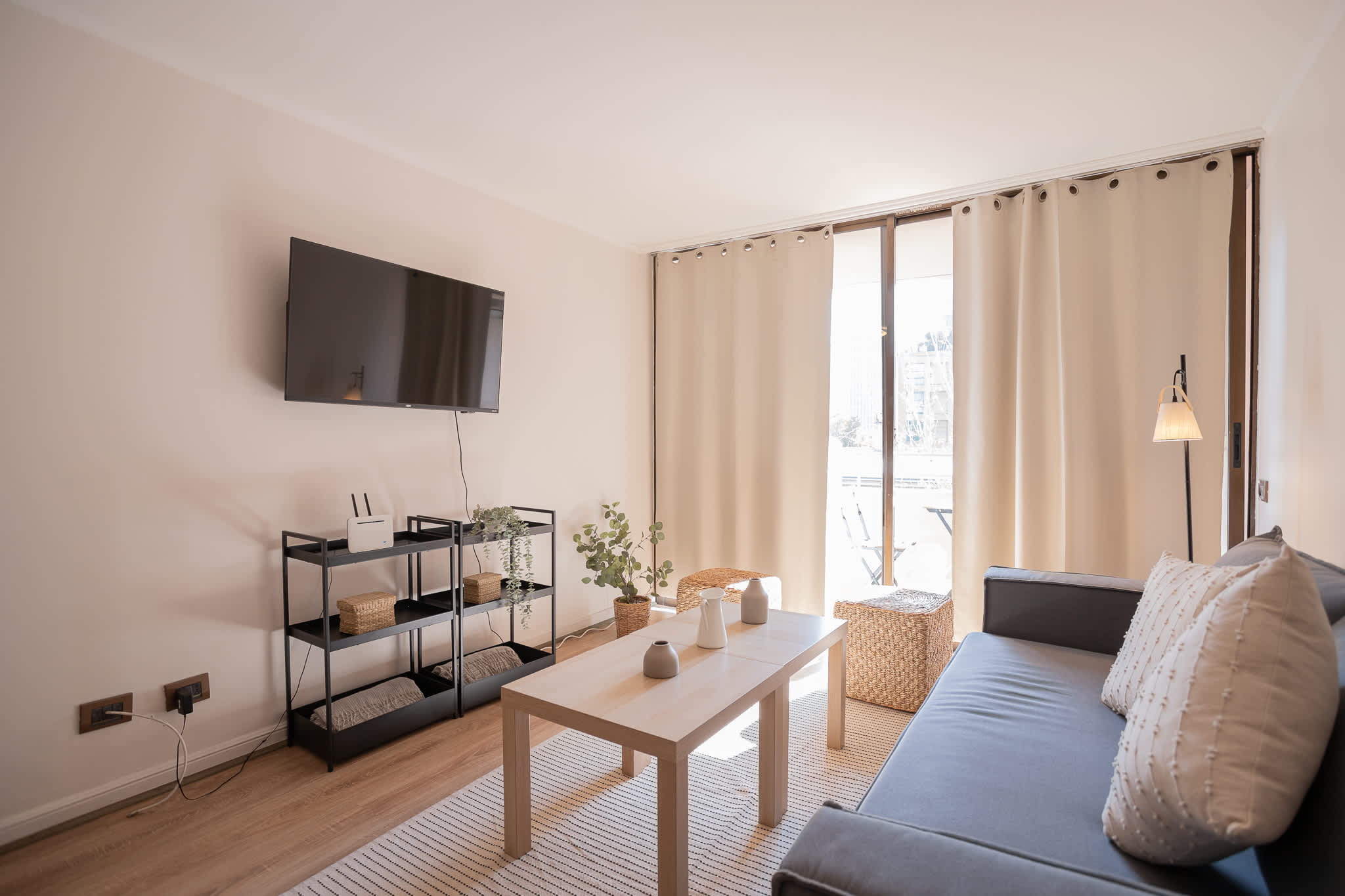 Bright and cozy living area with a modern touch, perfect for relaxing after exploring the city.