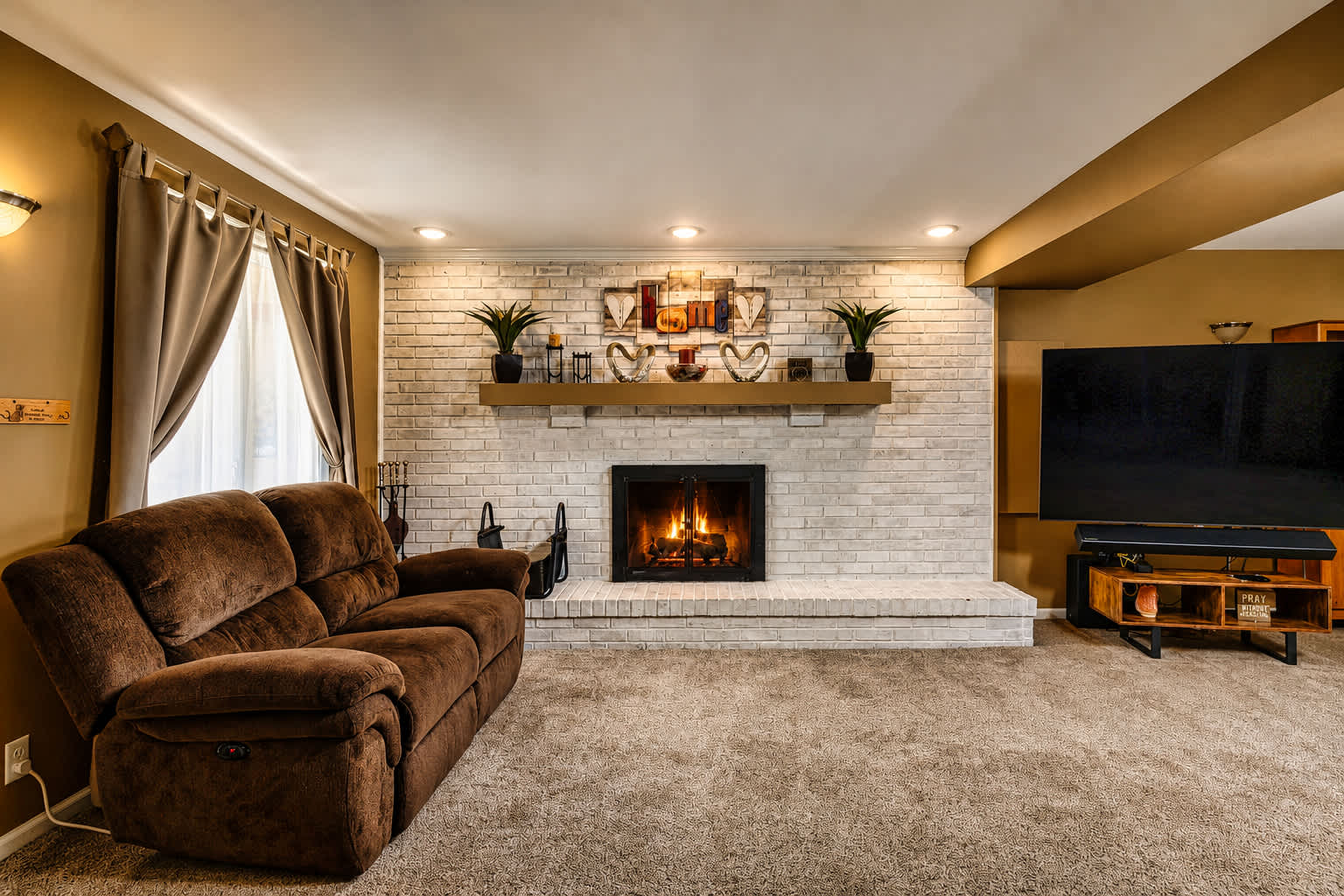 Comfortable seating, stone fireplace, and Smart TV for cozy evenings