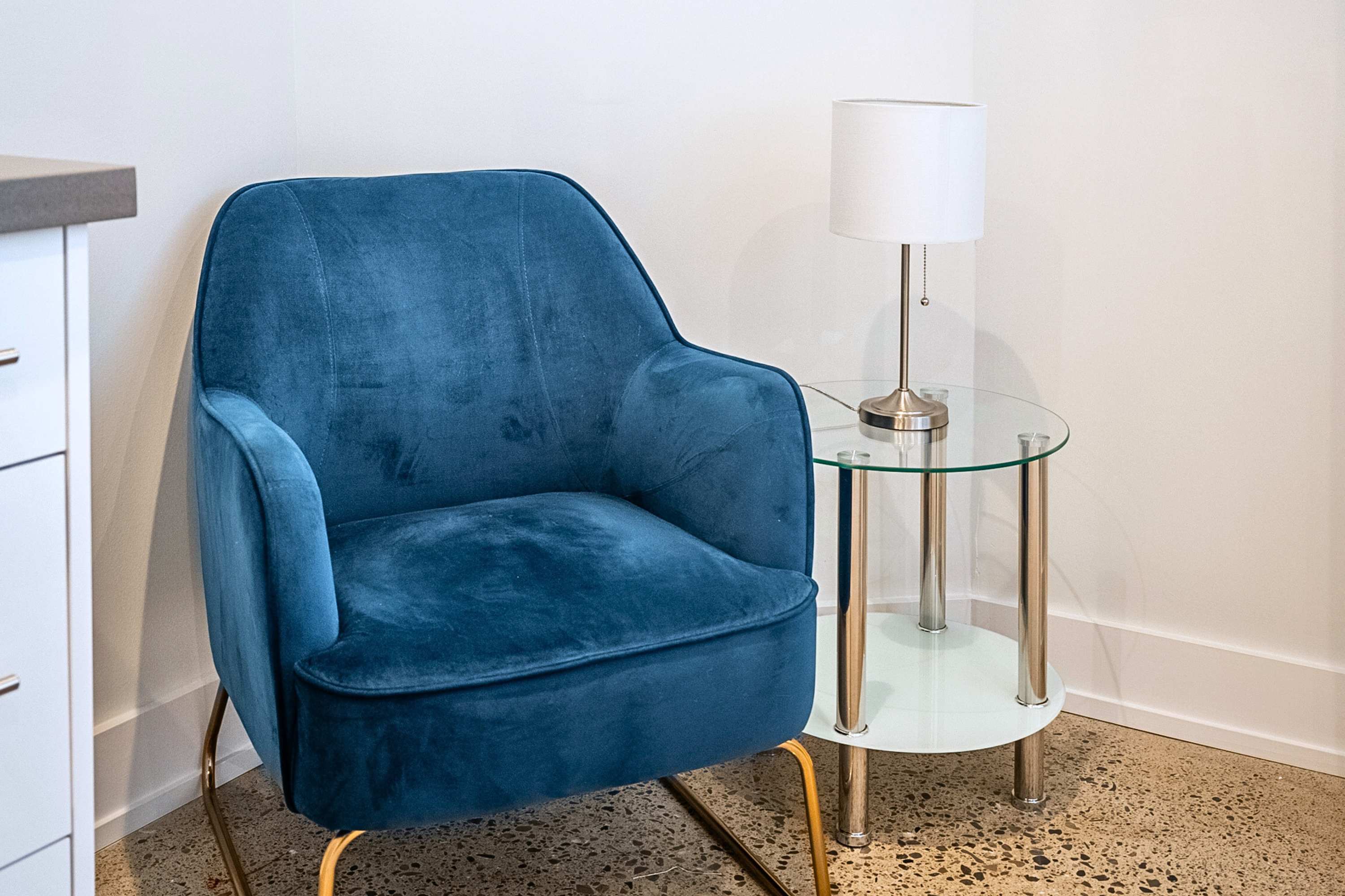 A cozy corner retreat with a comfortable chair and warm ambient lighting