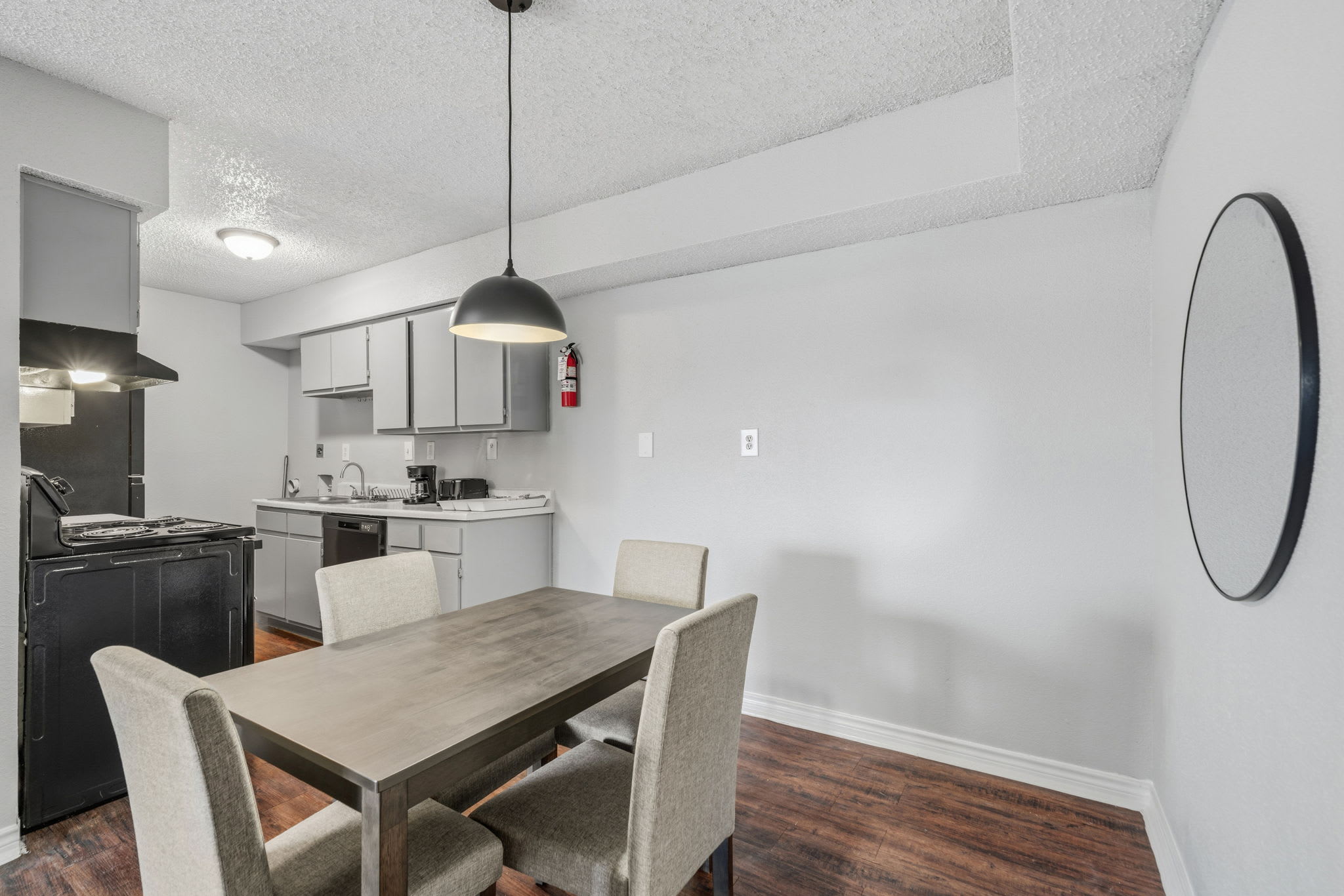 Cozy kitchen and dining area with modern amenities, perfect for a home-cooked meal.