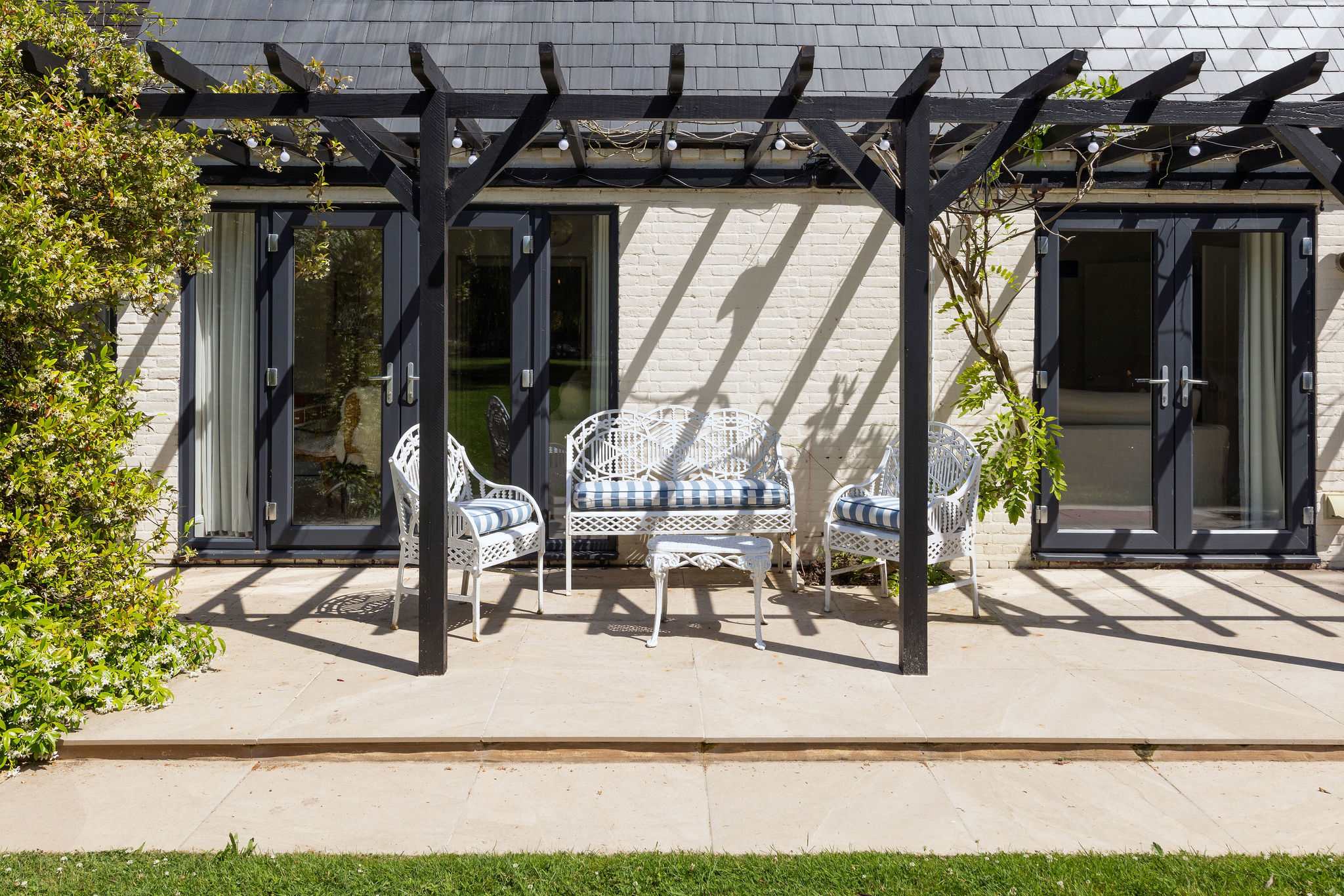 Sheltered terrace with comfortable seating, perfect for quiet mornings and leisurely afternoon breaks