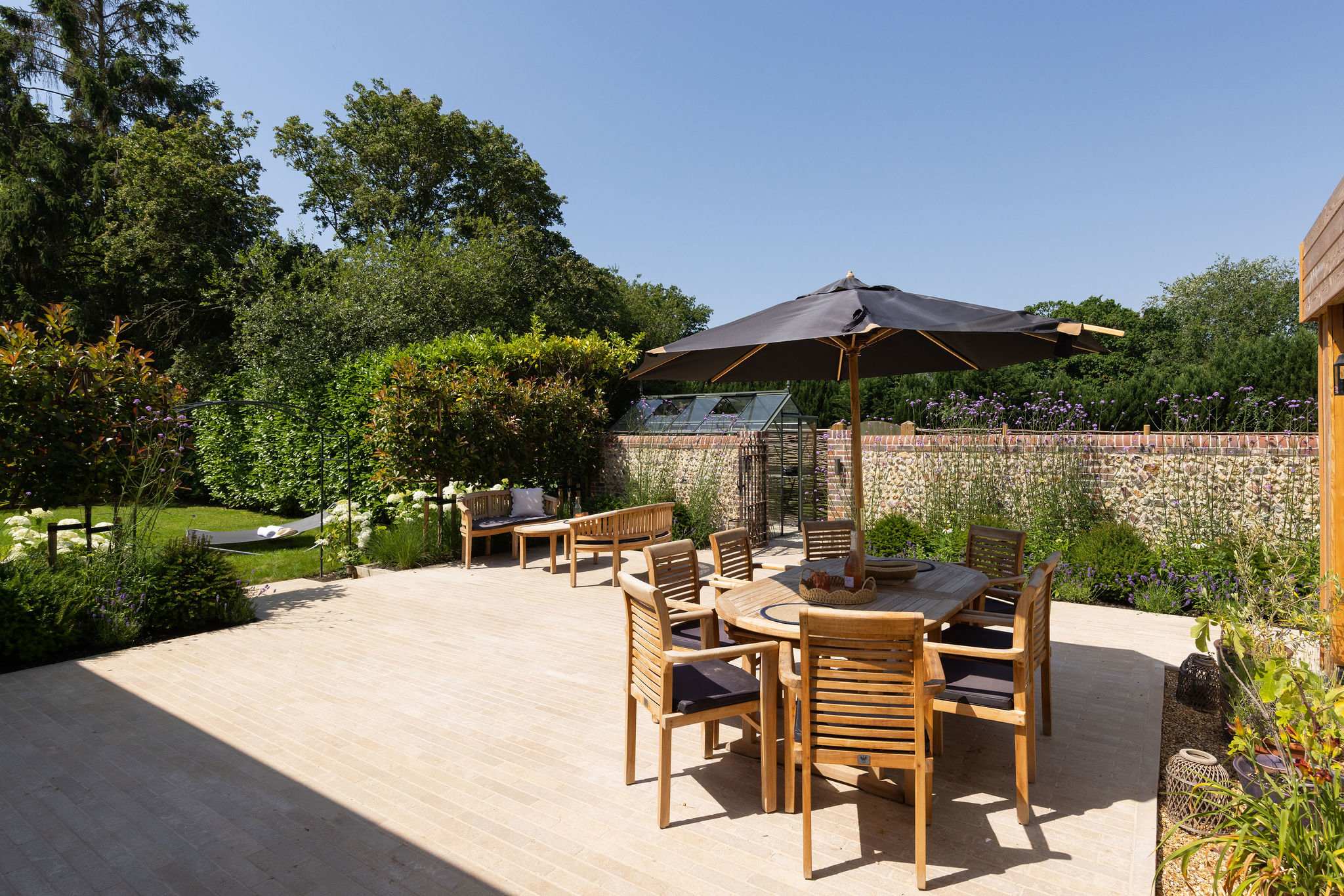 Outdoor dining area with parasol, perfect for leisurely meals in the sunshine