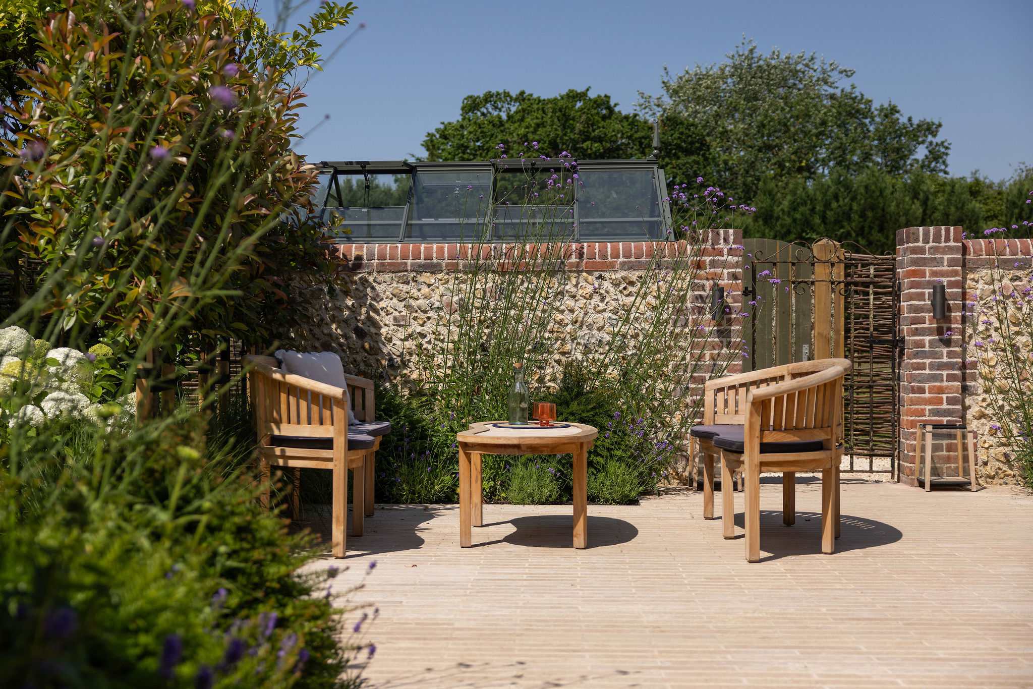 Quiet terrace seating area surrounded by greenery, ideal for peaceful moments outdoors