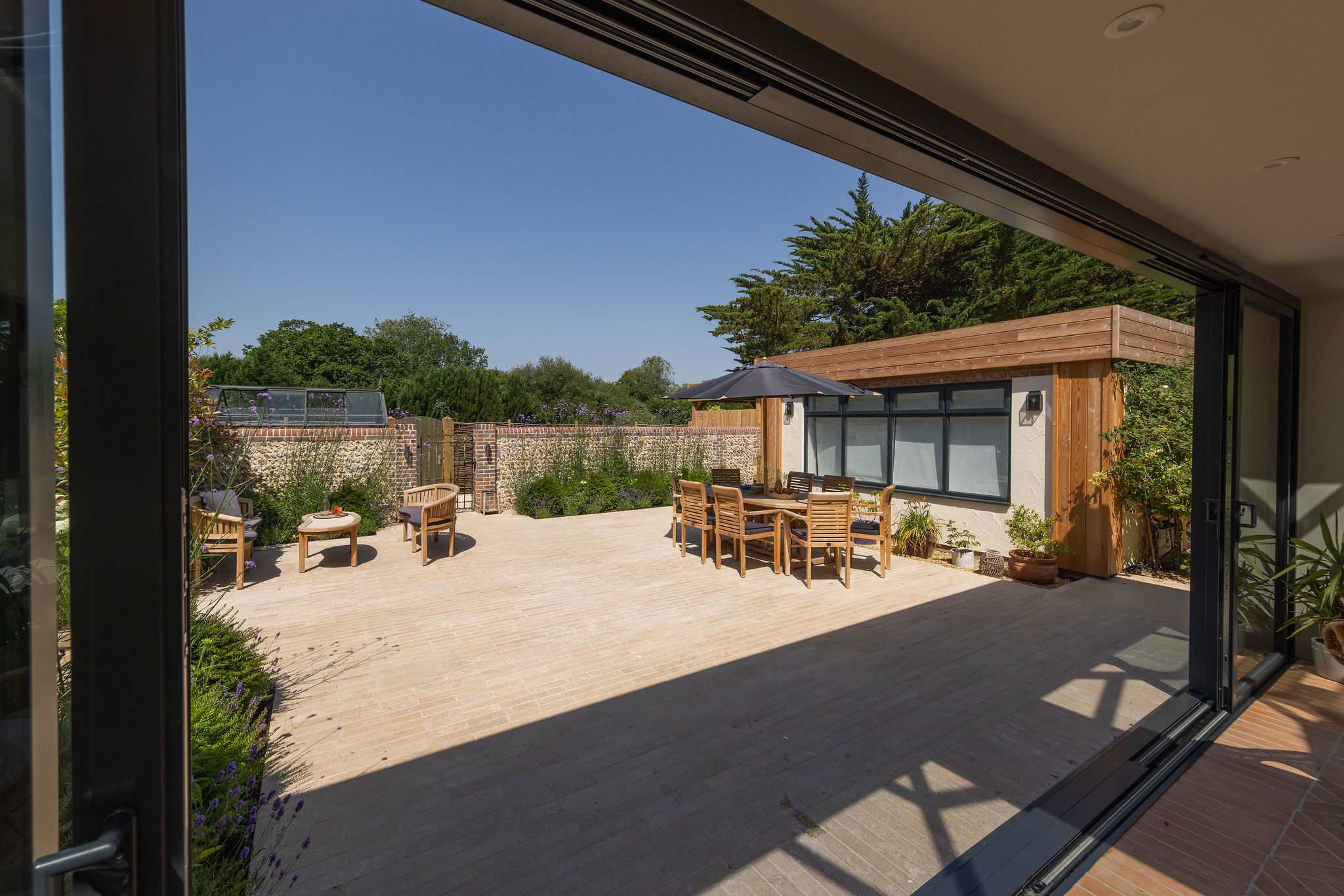 Expansive patio with outdoor seating, creating an inviting setting for al fresco relaxation