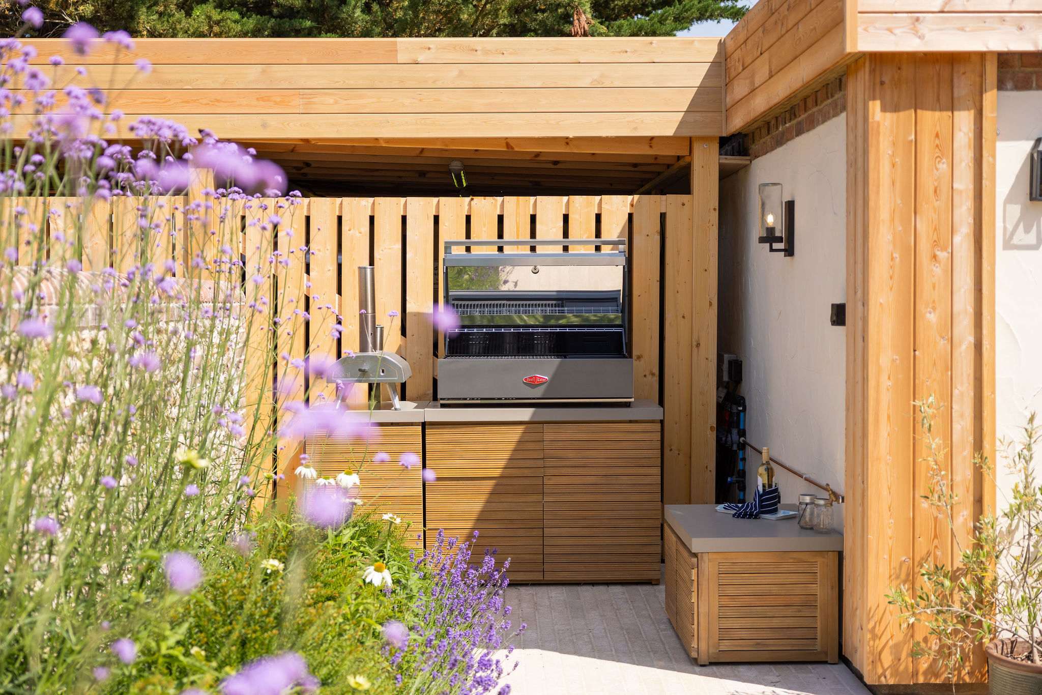 Stylish outdoor kitchen with built-in barbecue, perfect for effortless al fresco entertaining