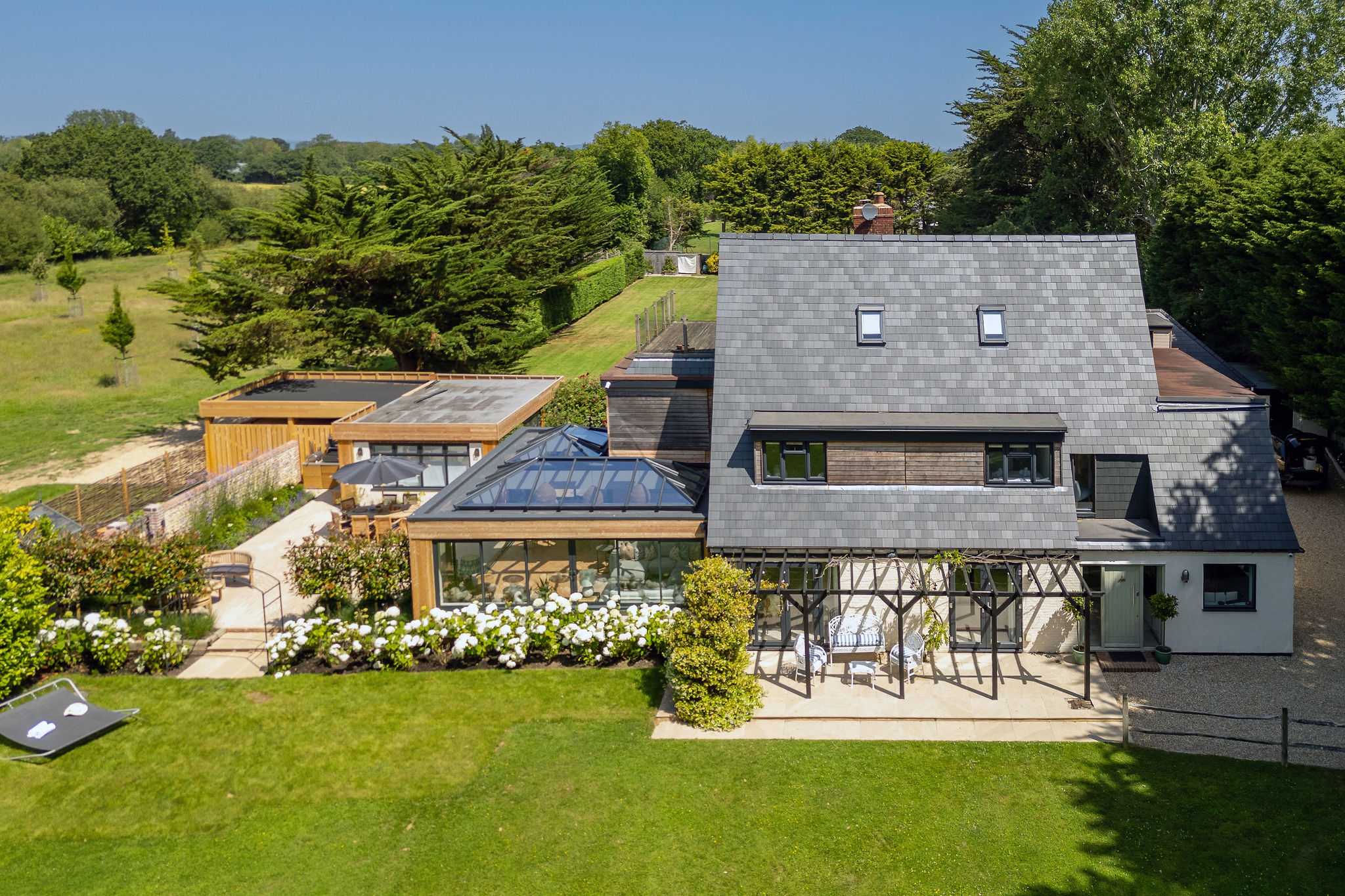 Aerial view of the secluded holiday home with landscaped gardens and generous outdoor living spaces