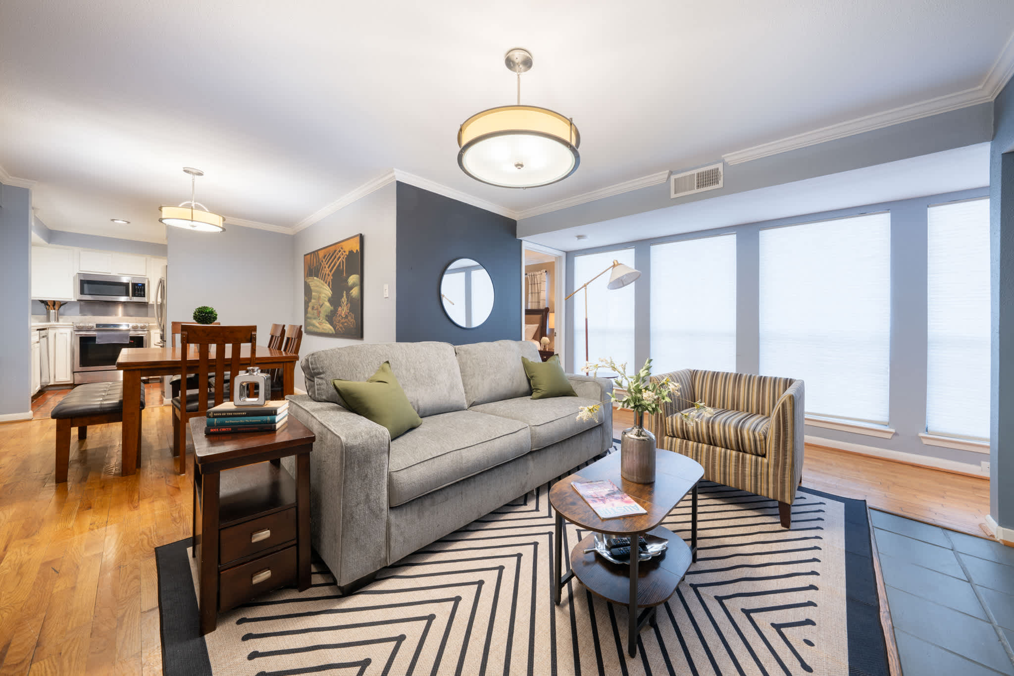 Spacious living area with modern decor and ample seating, perfect for relaxation and gatherings.