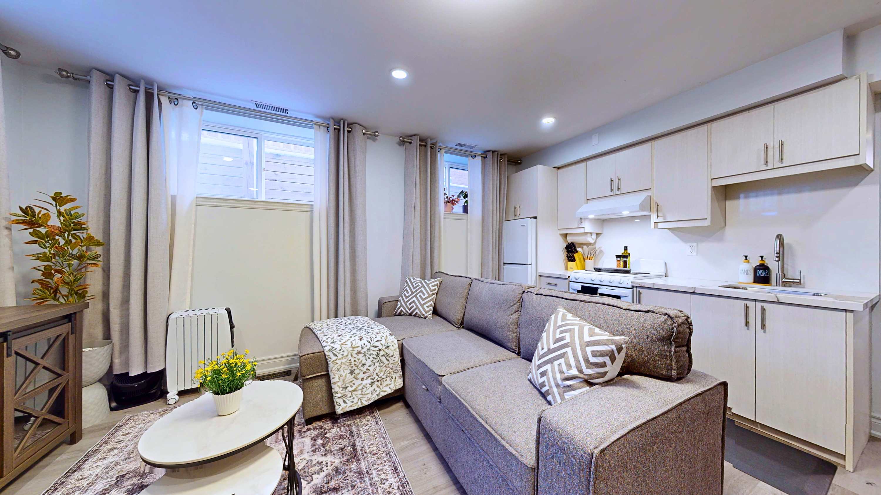 Move easily between the cozy sofa and the kitchen equipped for your meal prep needs