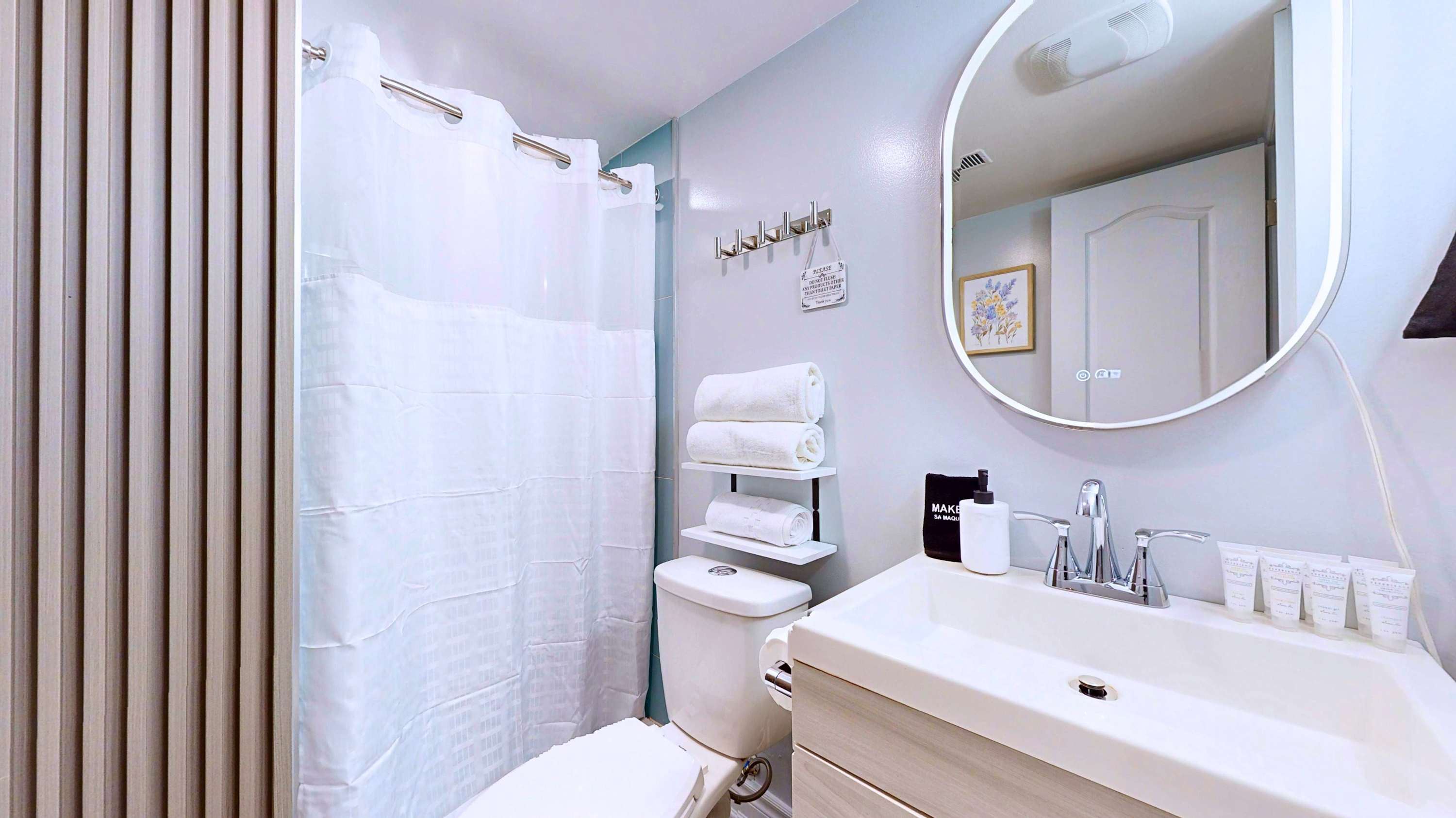 Refresh in this clean bathroom complete with a vanity sink mirror toilet and private shower with curtain