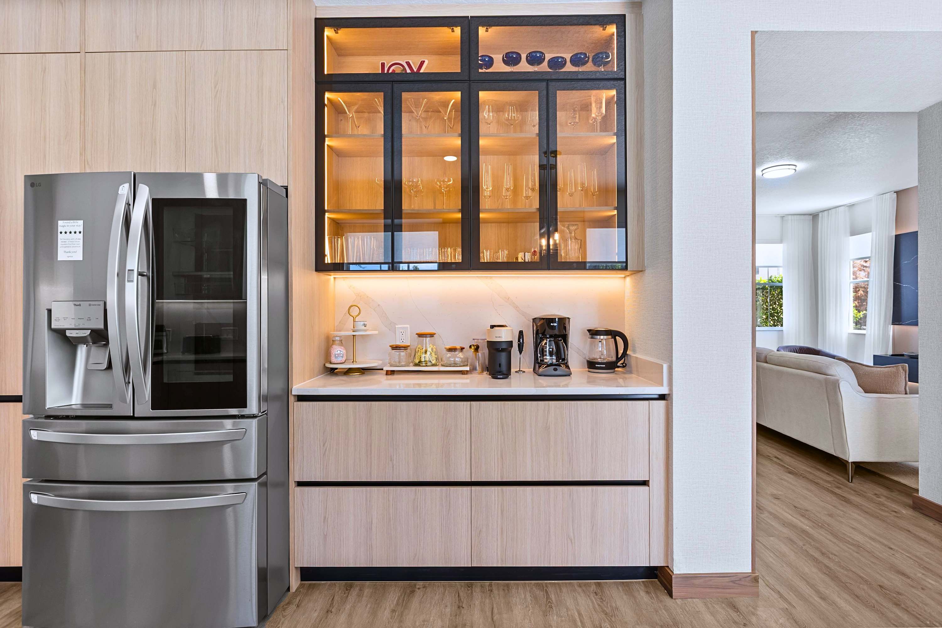 Keep the conversation flowing. Grab a cold drink from the smart fridge and step right into the cozy living room