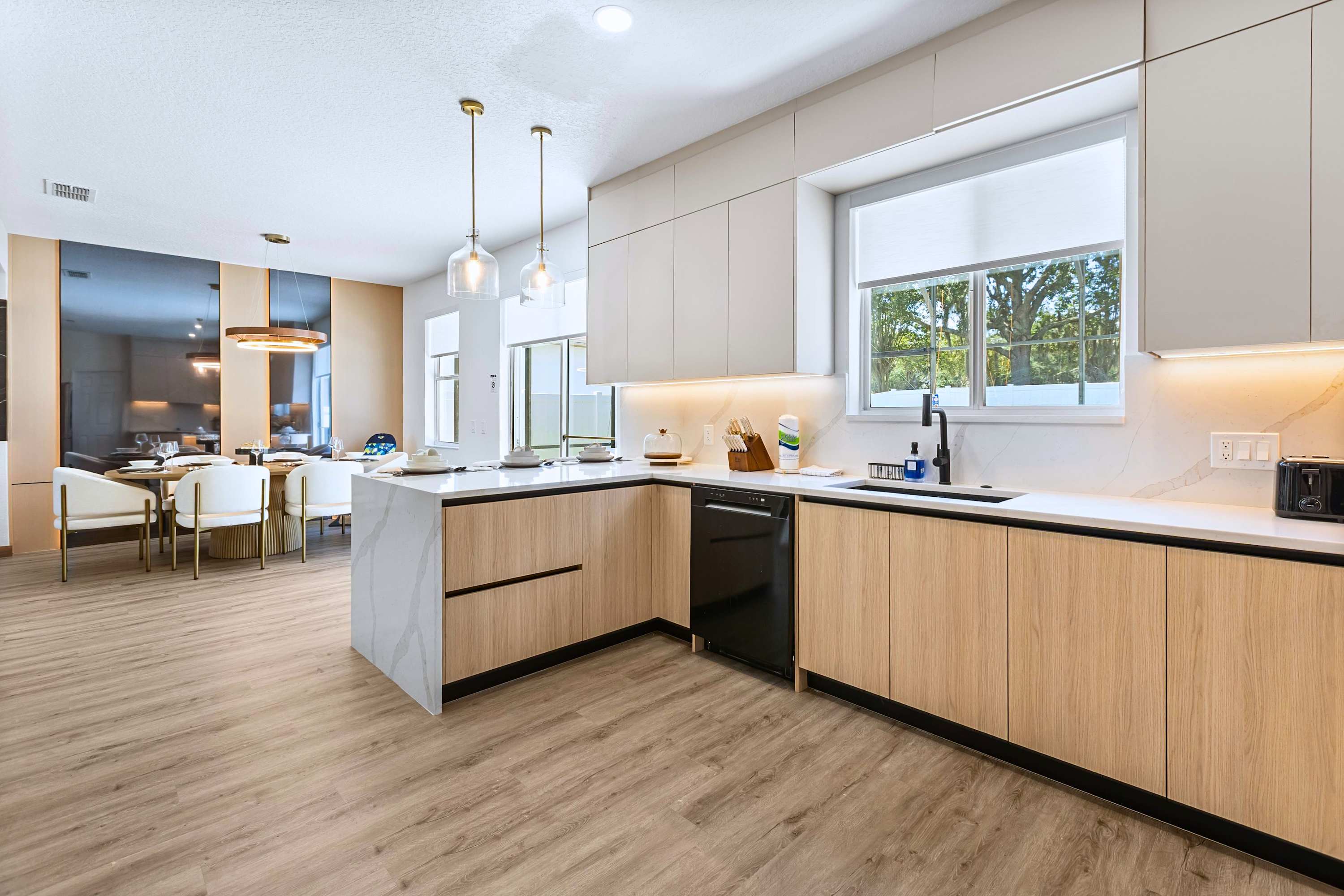 From quick morning breakfasts at the island to cozy family dinners at the table. This space is built for gathering