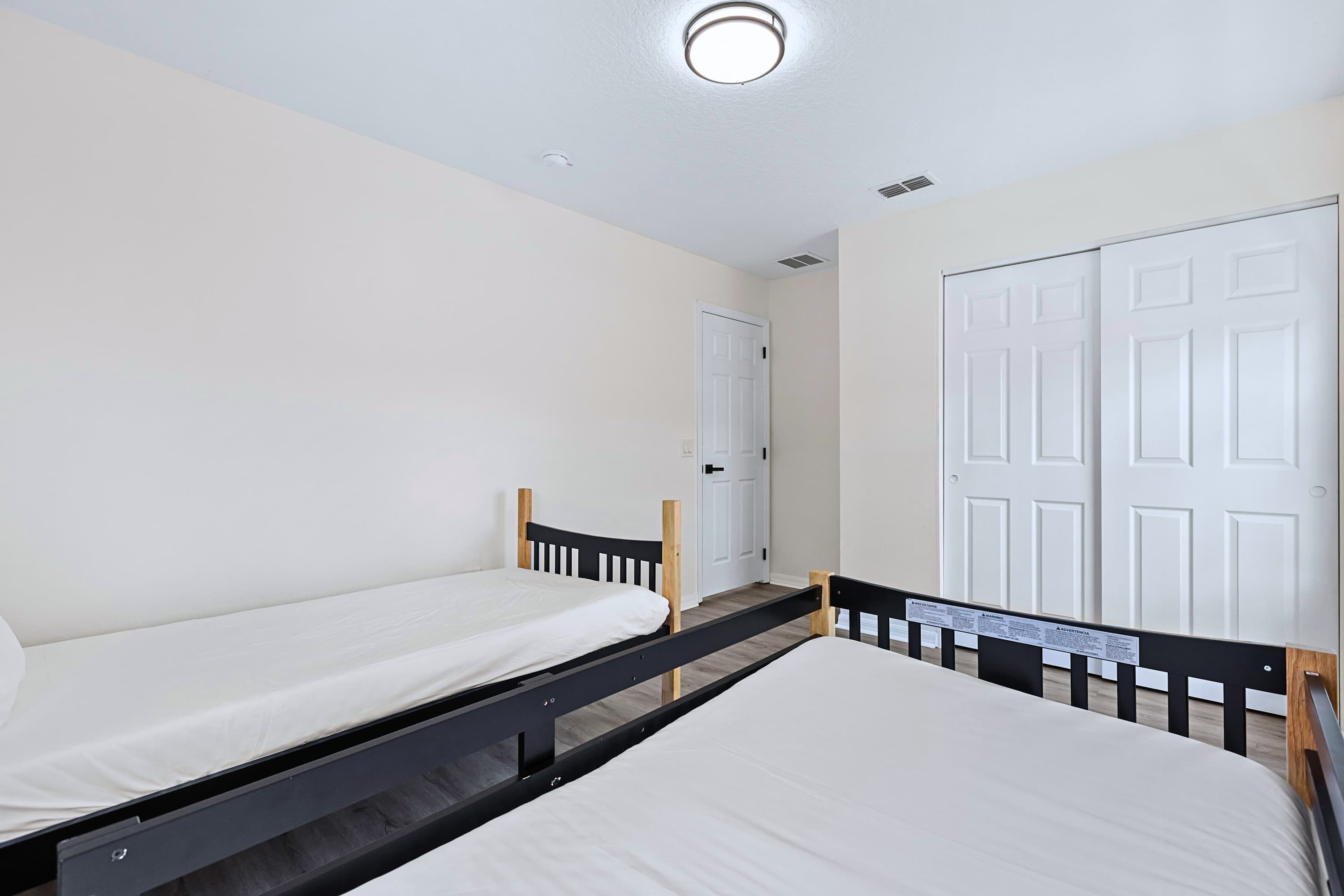 Simple, clean, and comfortable. Two single beds with crisp linens and large windows for a bright, refreshing feel