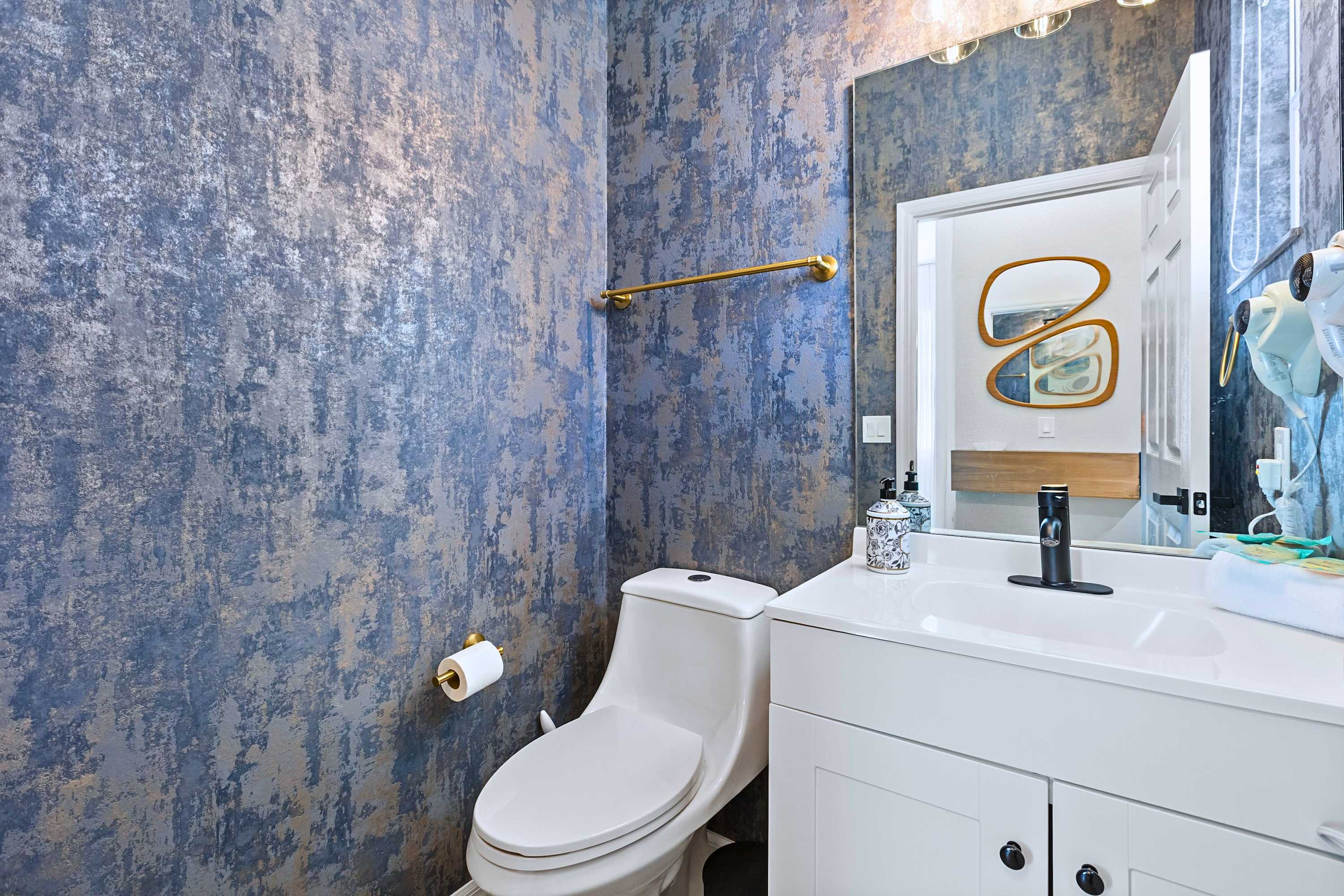 Simple, stylish, and clean. This convenient guest bathroom has everything you need to get ready for the day