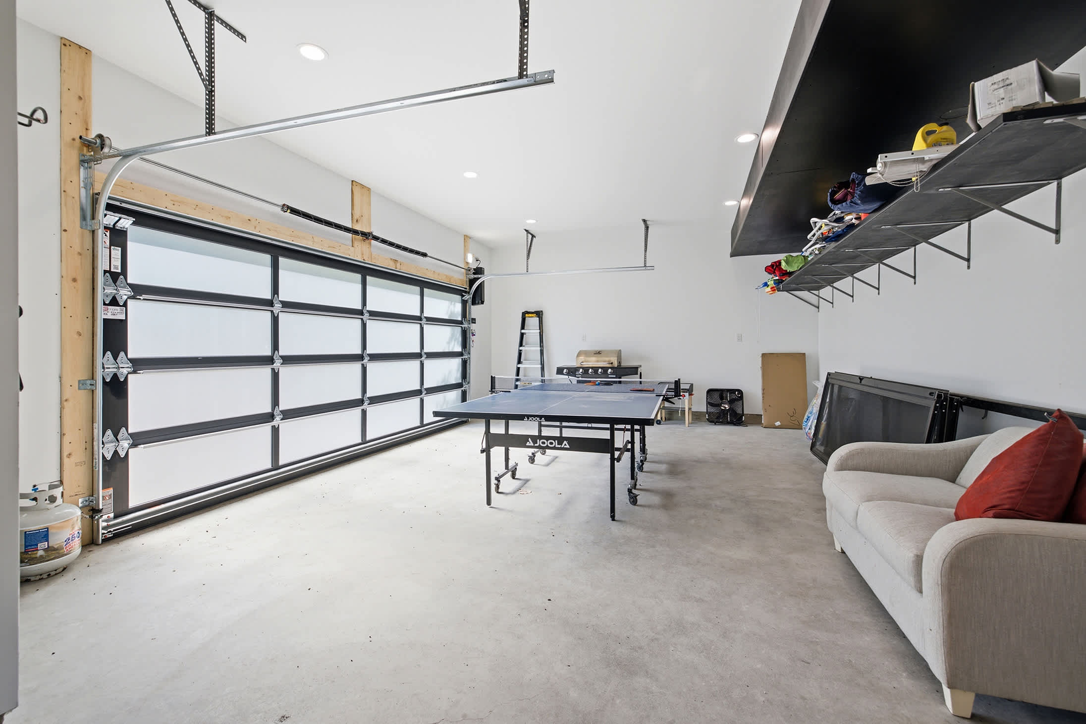 Garage recreation space with a ping-pong table for all ages to enjoy.