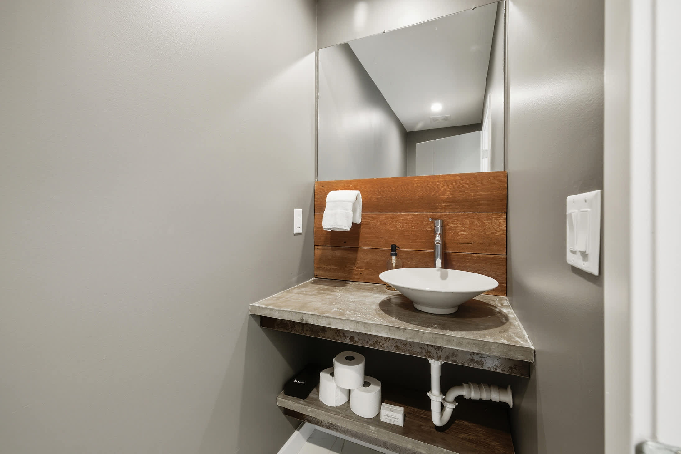 Lower level powder room adds convenient access from the guest bedrooms.