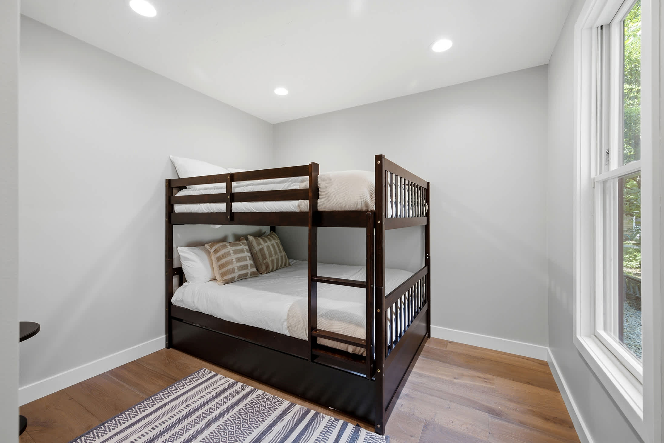 Bedroom 5 is on the lower level and has a double-sized bunk bed.