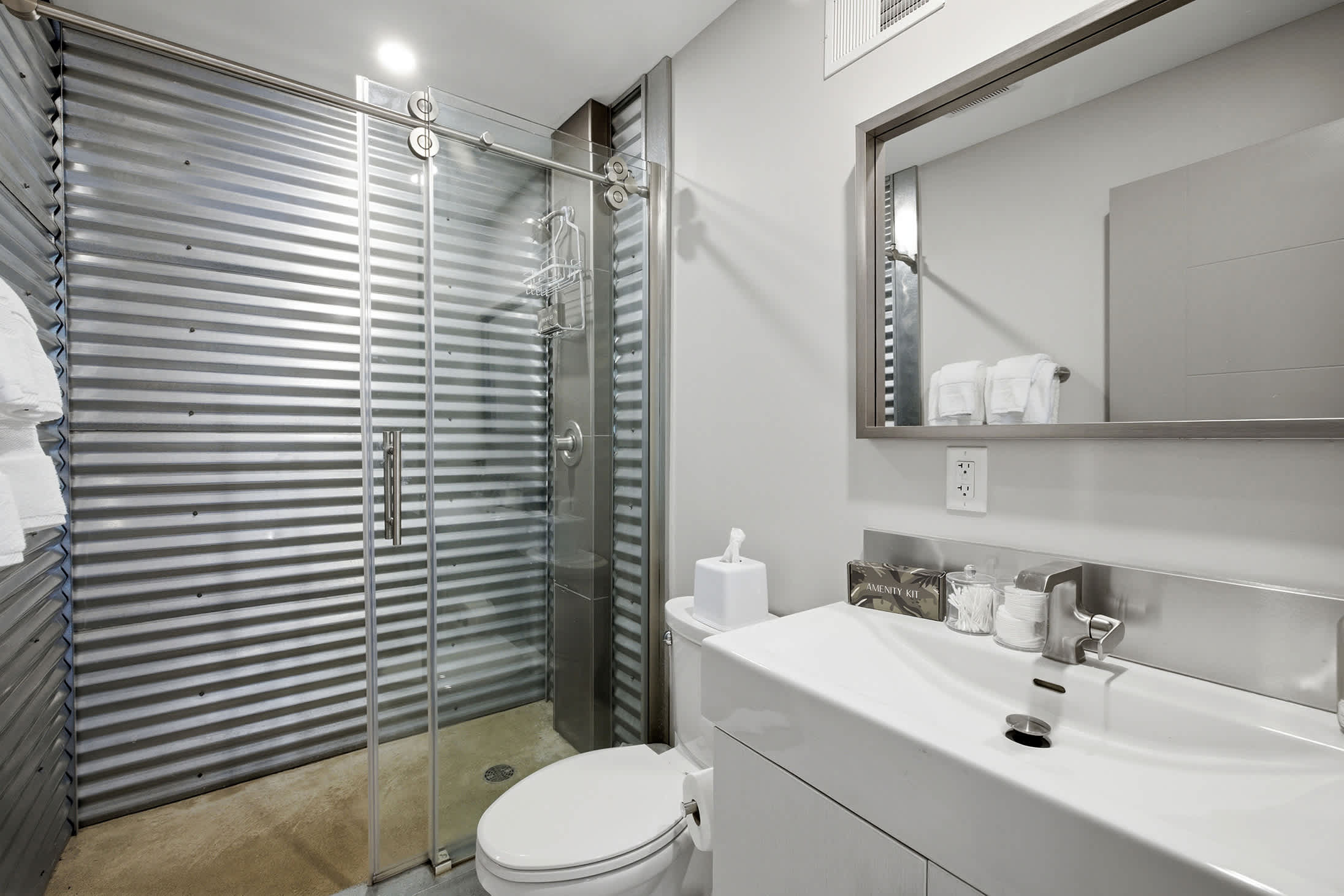 Lower level bathroom features a walk-in shower for added convenience.
