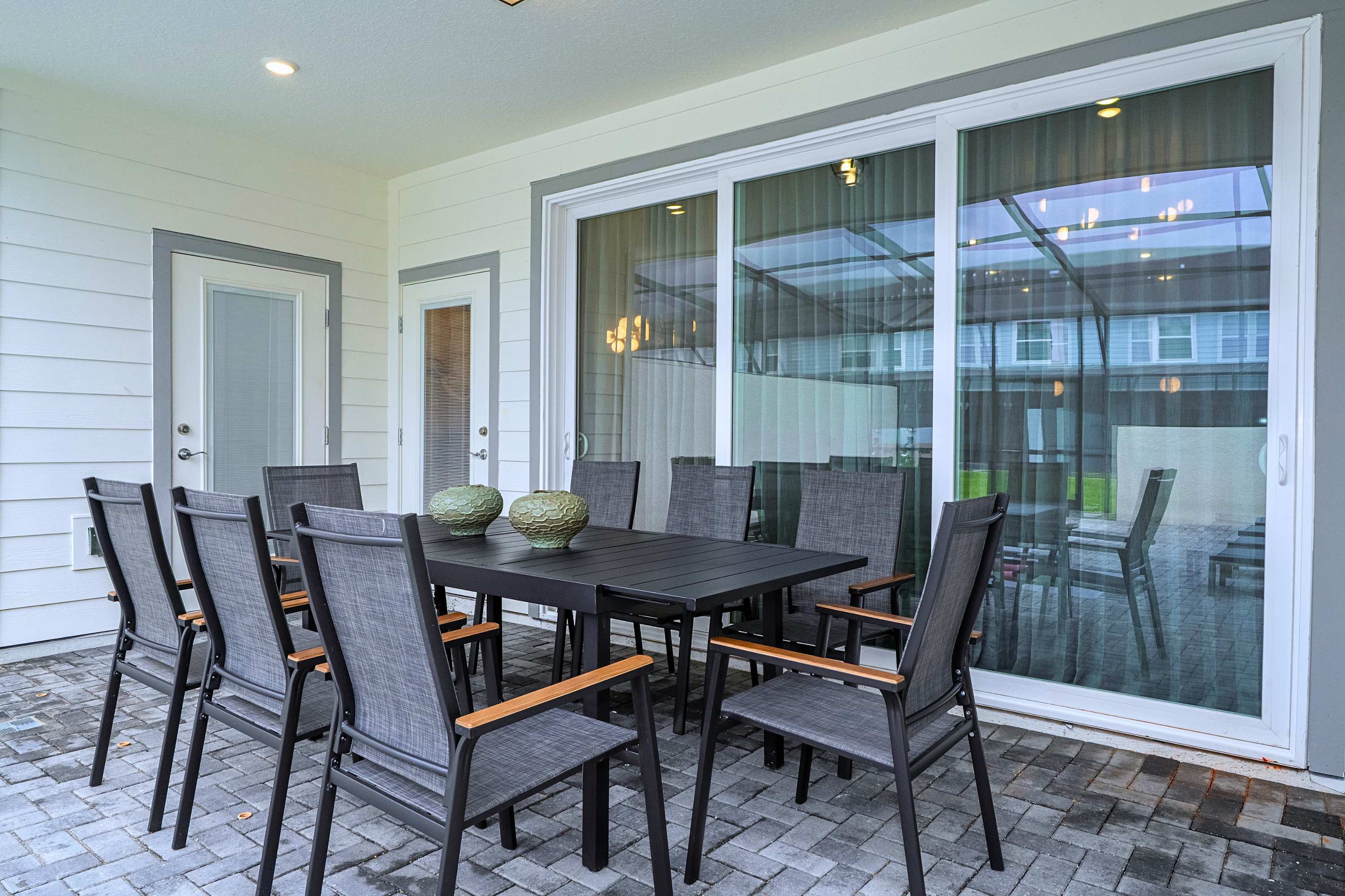 A spacious eight-seat dining area directly alongside the pool, offering the ultimate setup for open-air group dinners