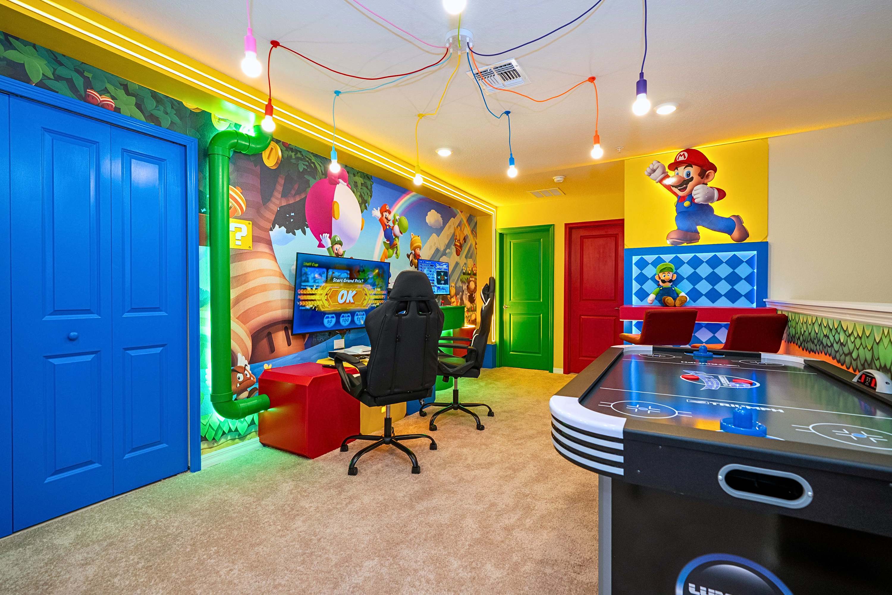 The ultimate entertainment zone complete with fast-paced air hockey, retro arcades, a console setup with an ergonomic gaming chair, and a stylish high-chair lounge area to kick back and socialize