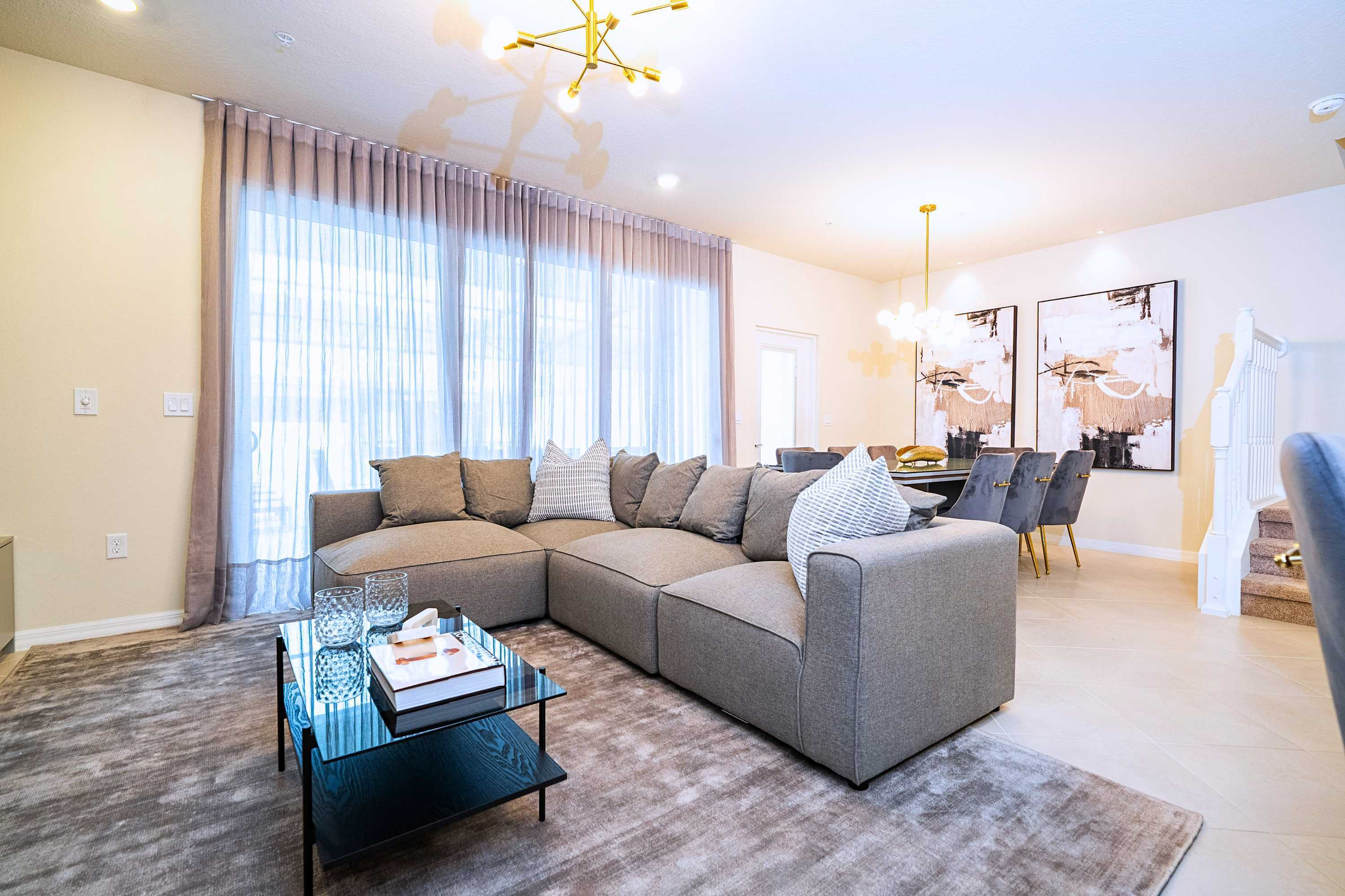 A seamless open layout that beautifully blends the comfortable living area and spacious dining setup for effortless entertaining