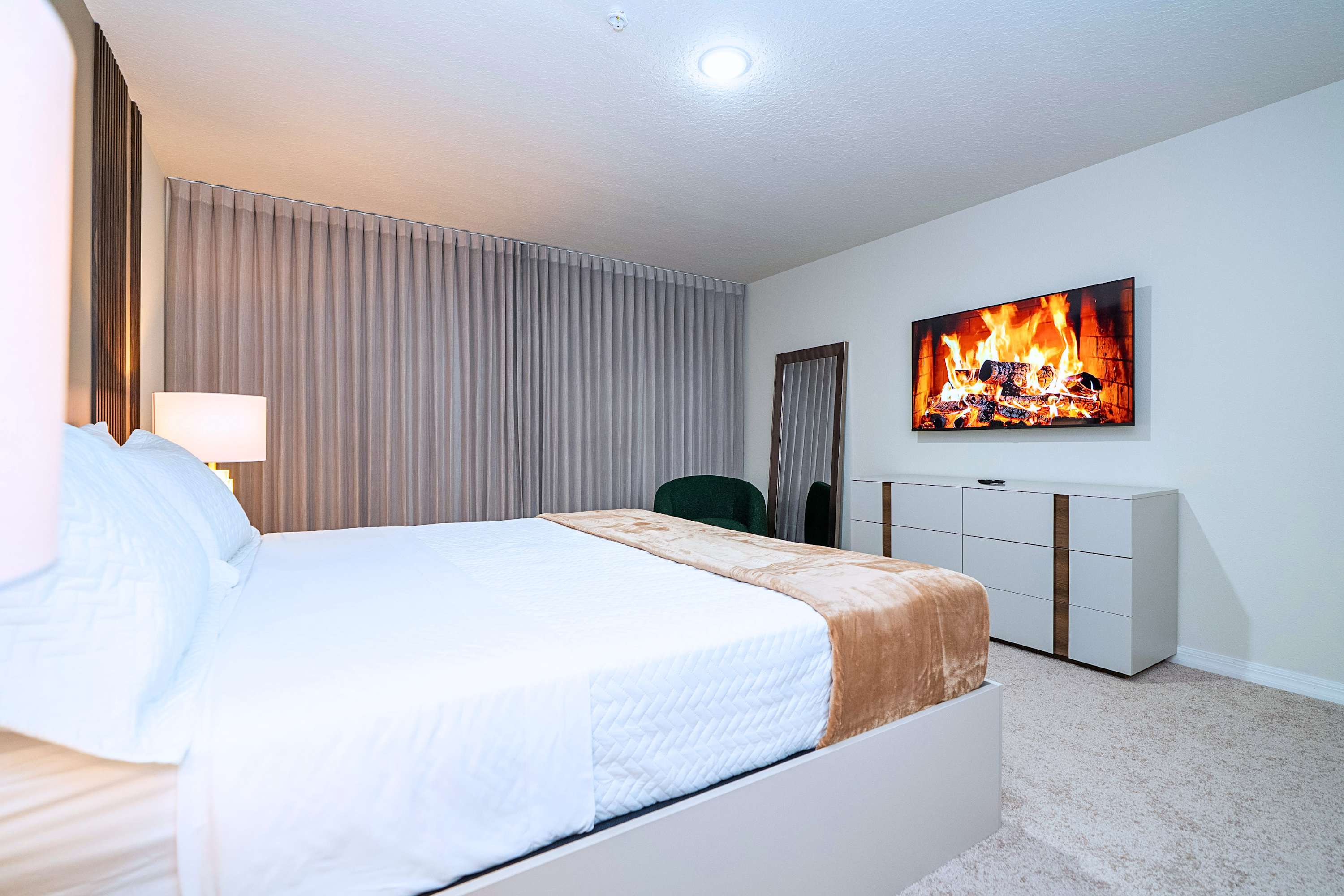 Catch your favorite shows from the comfort of your king bed, complete with a stylish wall mirror