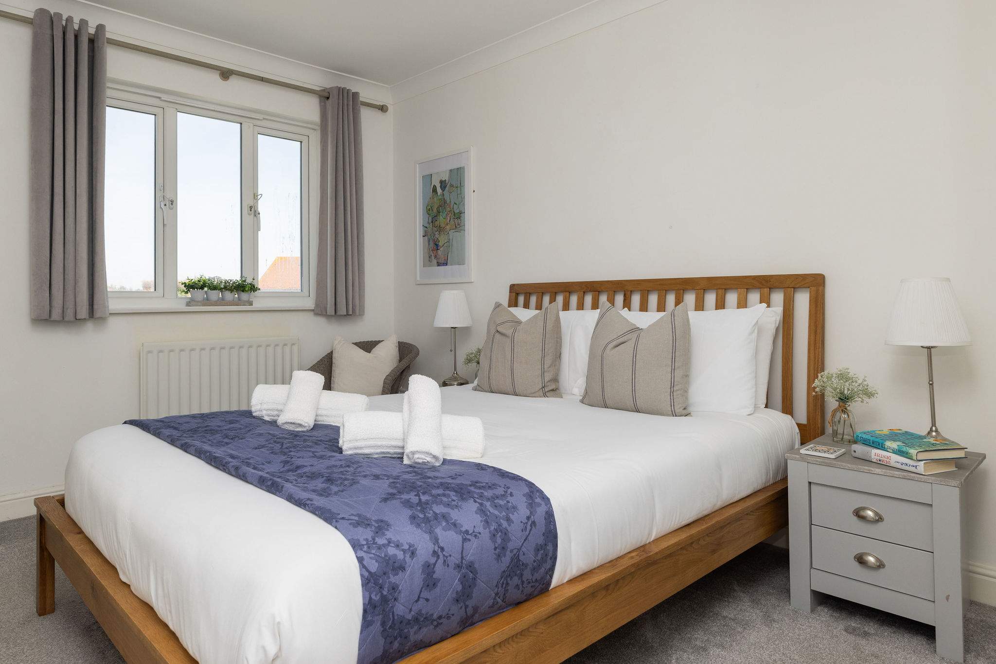 Spacious and inviting king bedroom with soft linens for a restful coastal getaway.