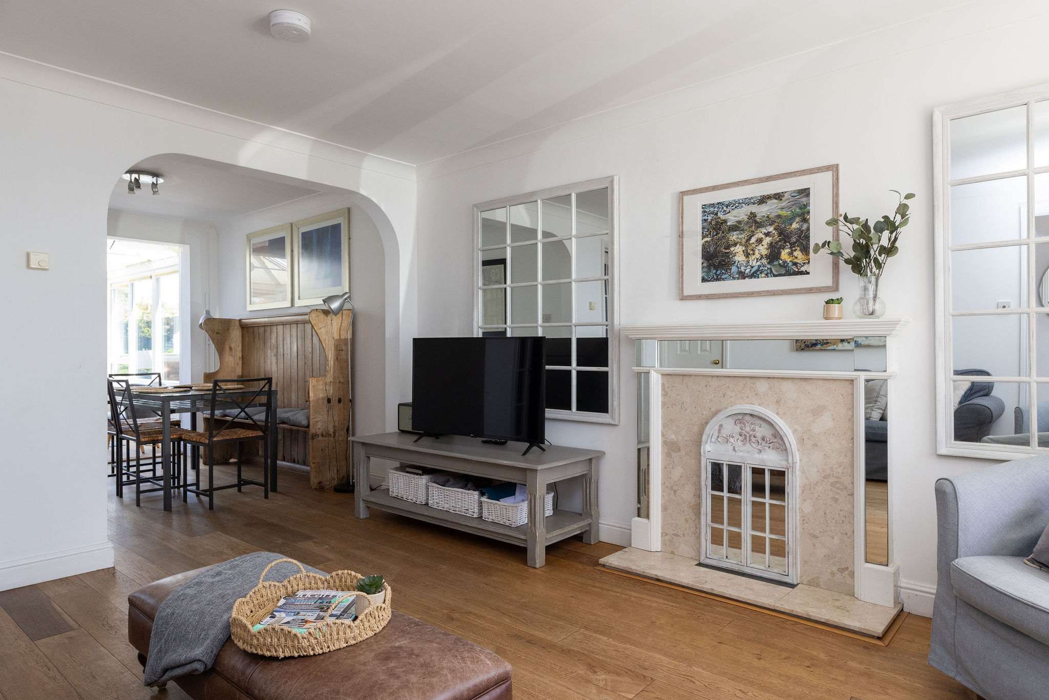 Spacious living area with stylish décor, ideal for relaxing after seaside adventures together.