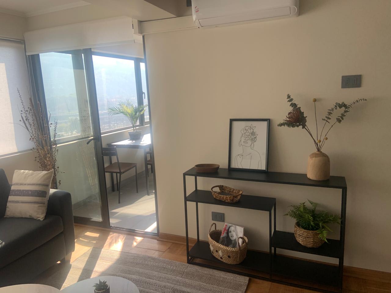 Relax in this cozy living area with stylish decor and abundant natural light, perfect for unwinding after a day of exploring.