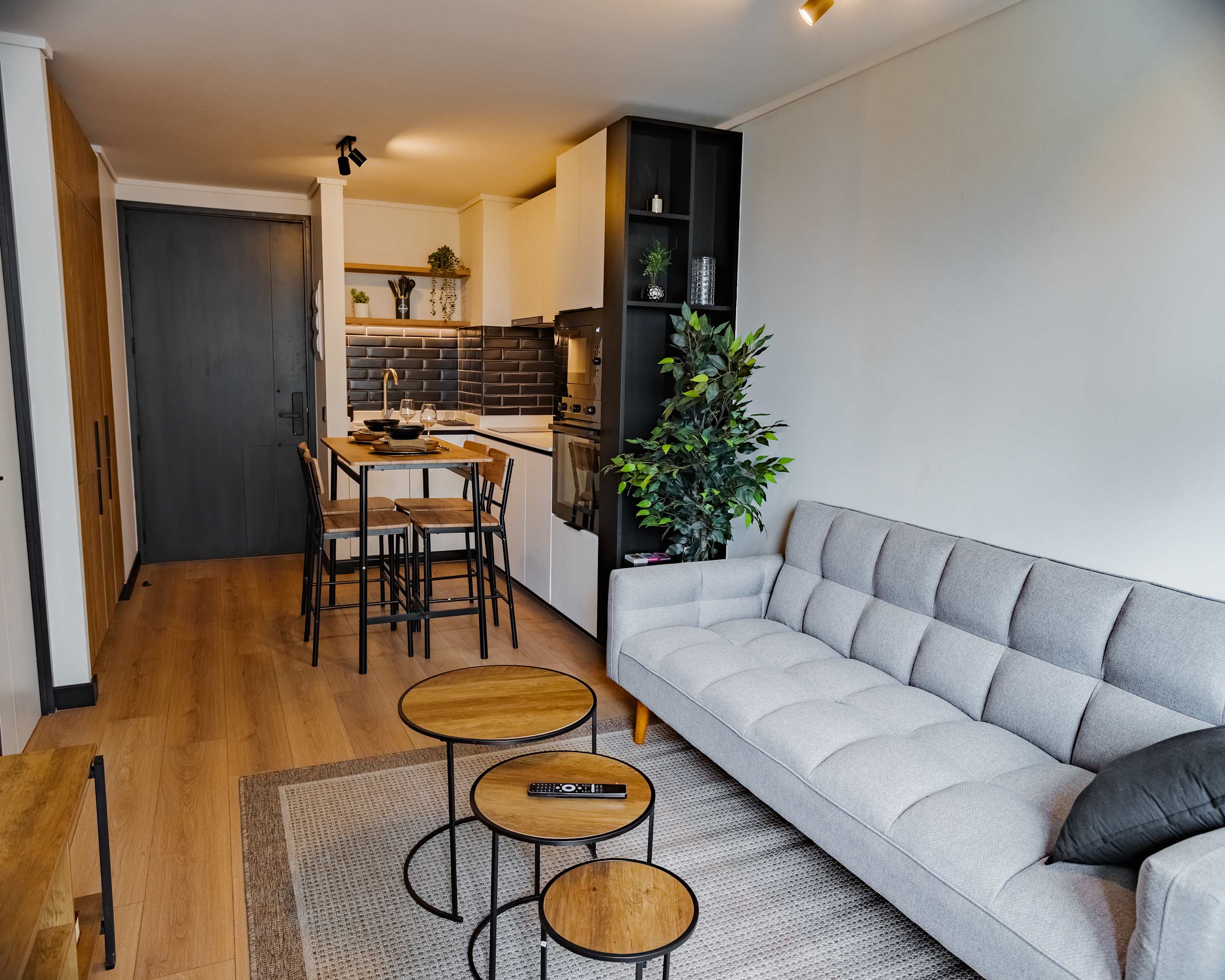 Cozy and modern studio with a stylish living area and fully equipped kitchen, perfect for a comfortable stay in the heart of the city.