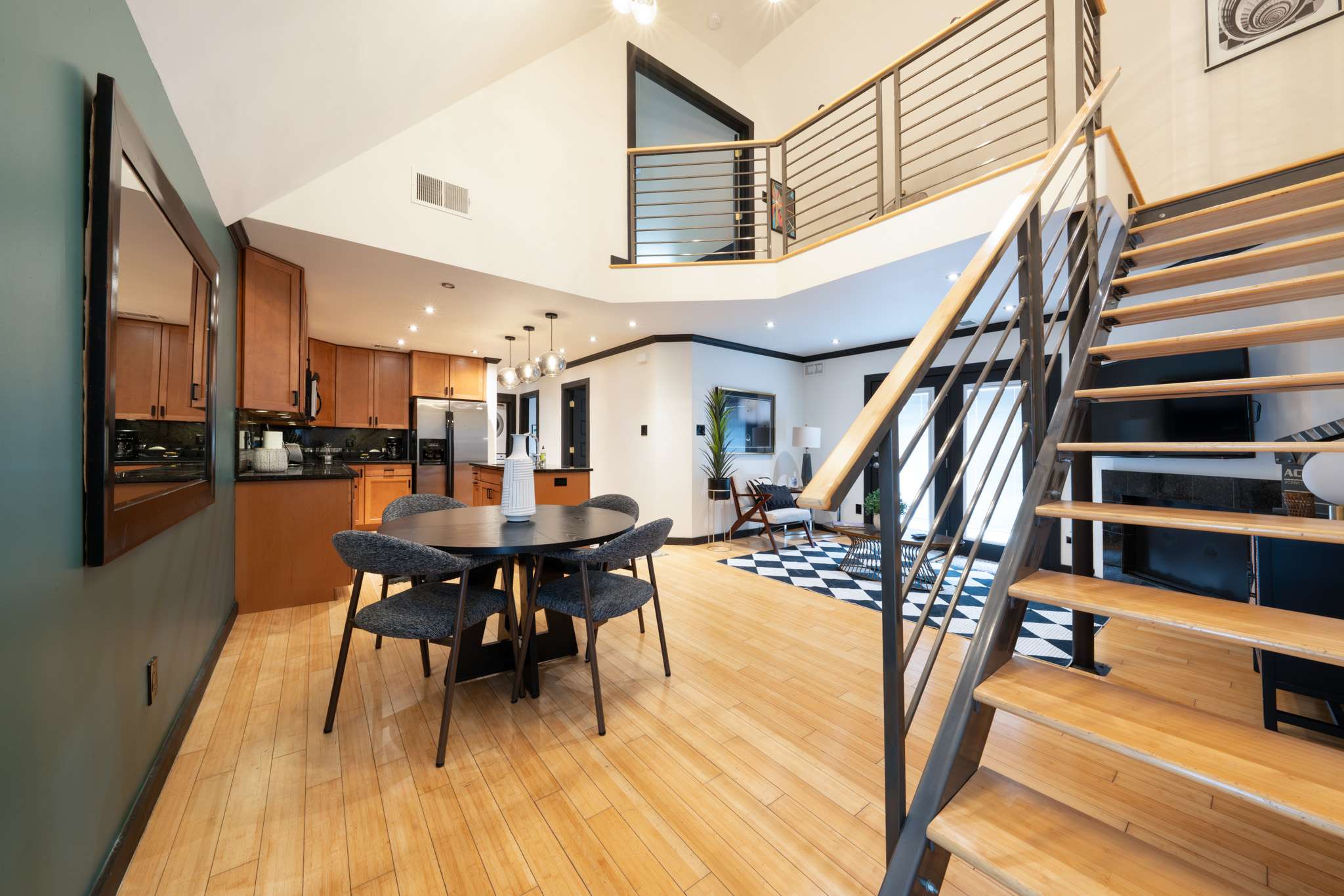 Spacious open-concept living area with modern design, perfect for family gatherings and relaxation.
