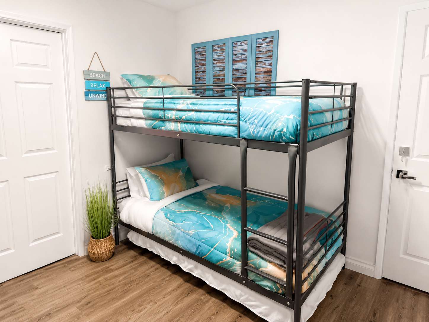 Guest Bedroom #3 provides a bunk bed with two singles and a TV.