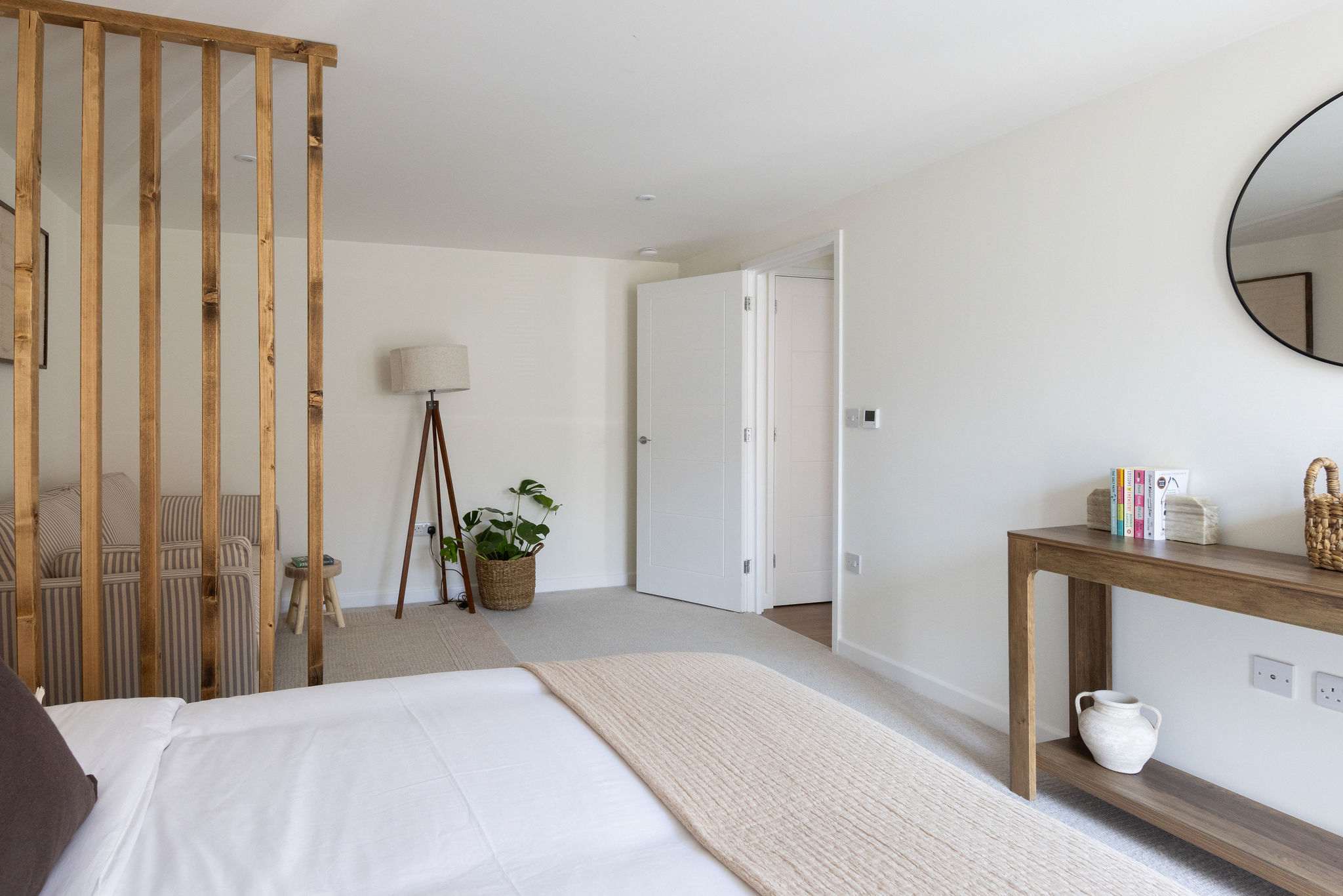 Spacious king bedroom with stylish furnishings, creating a relaxing retreat for your Chichester getaway.