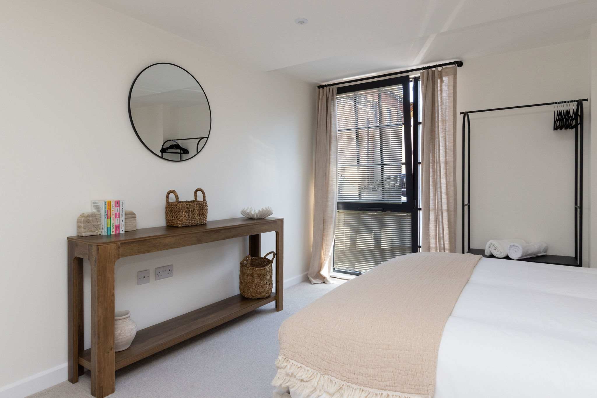 Bright and spacious king bedroom with stylish furnishings, perfect for a relaxing city break.