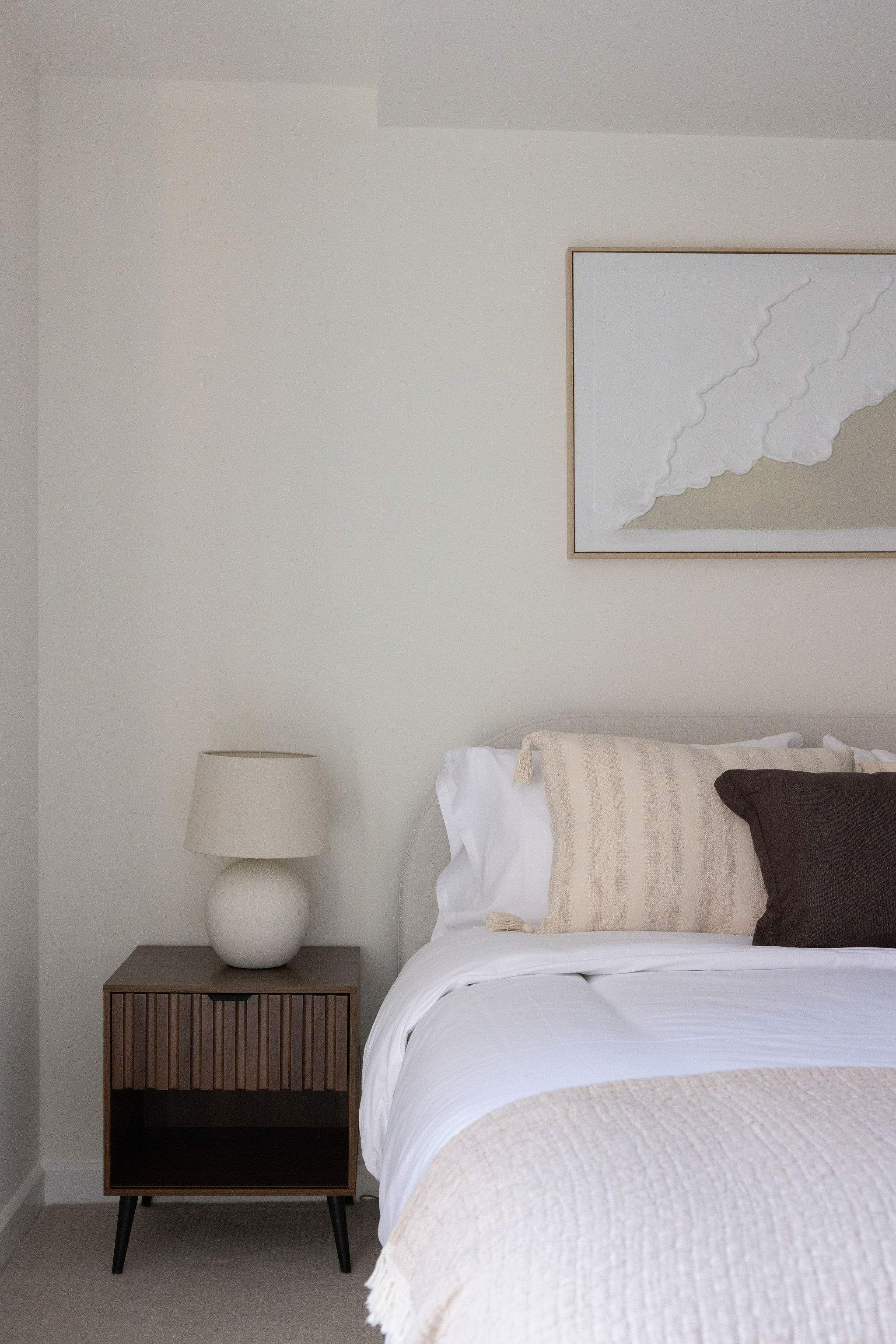 Elegant king bed with quality linen, ensuring a restful stay in central Chichester.