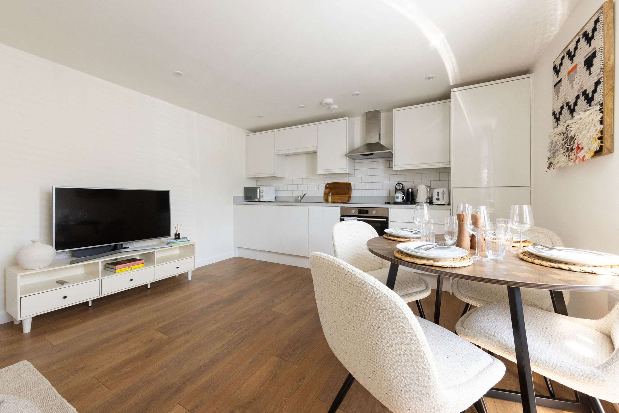 Contemporary kitchen and dining area with Smart TV, ideal for relaxing after exploring Chichester.